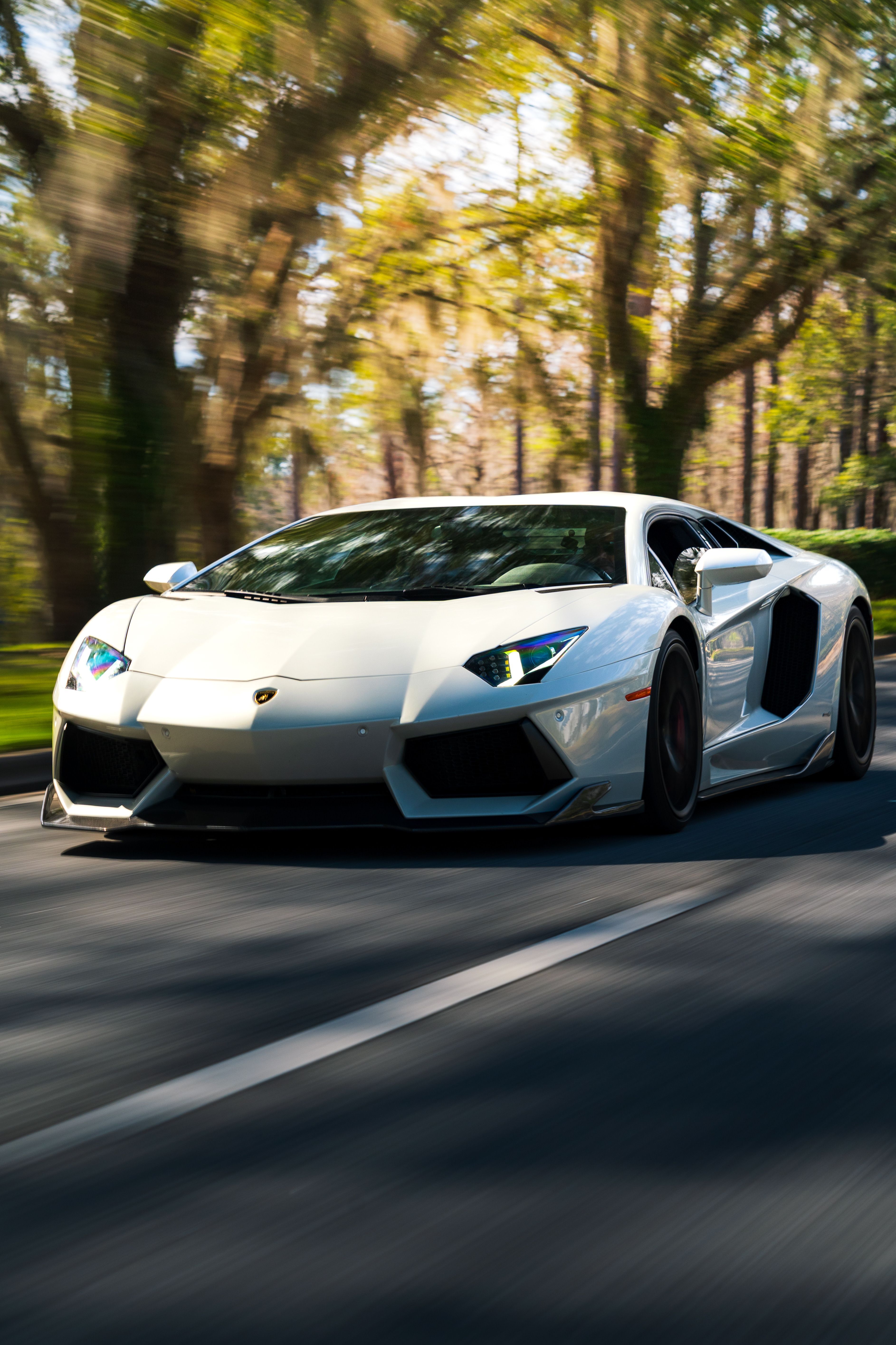 3772x5658 High Speed Silver Sports Car On A Scenic Drive · Free