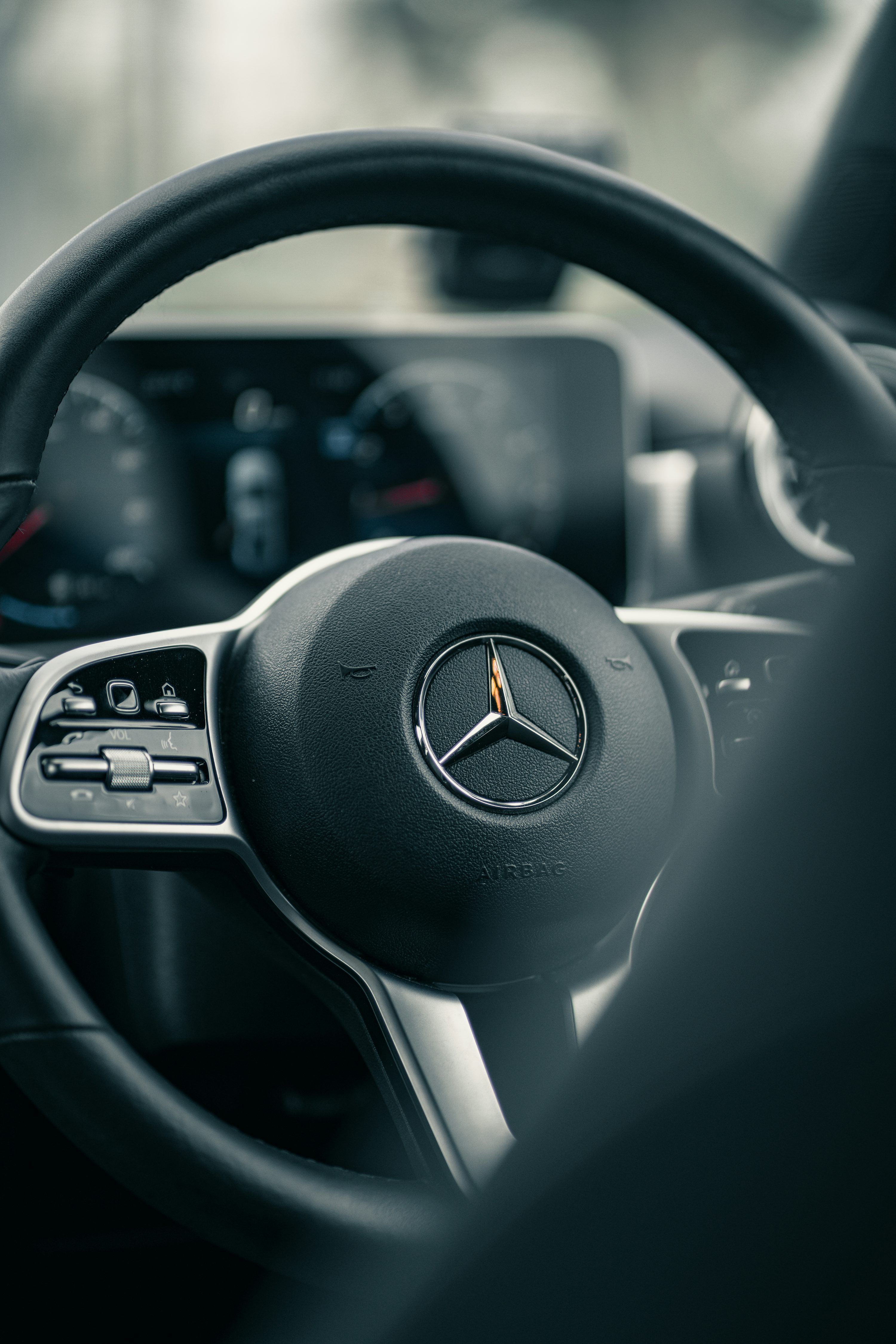 3000x4500 Black mercedes benz steering wheel