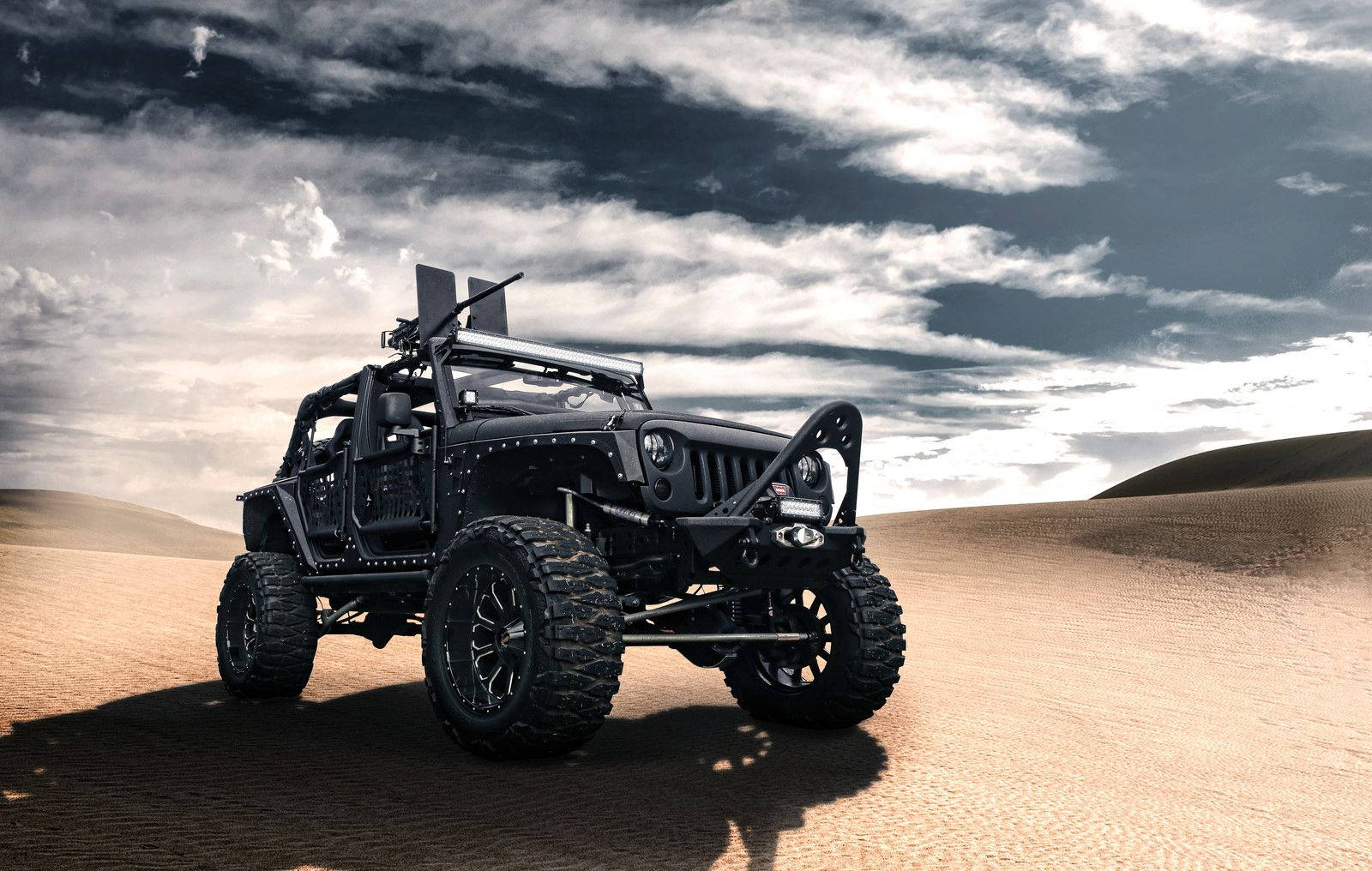 1600x1016 Download Rugged Black Jeep in the Wilderness Wallpaper