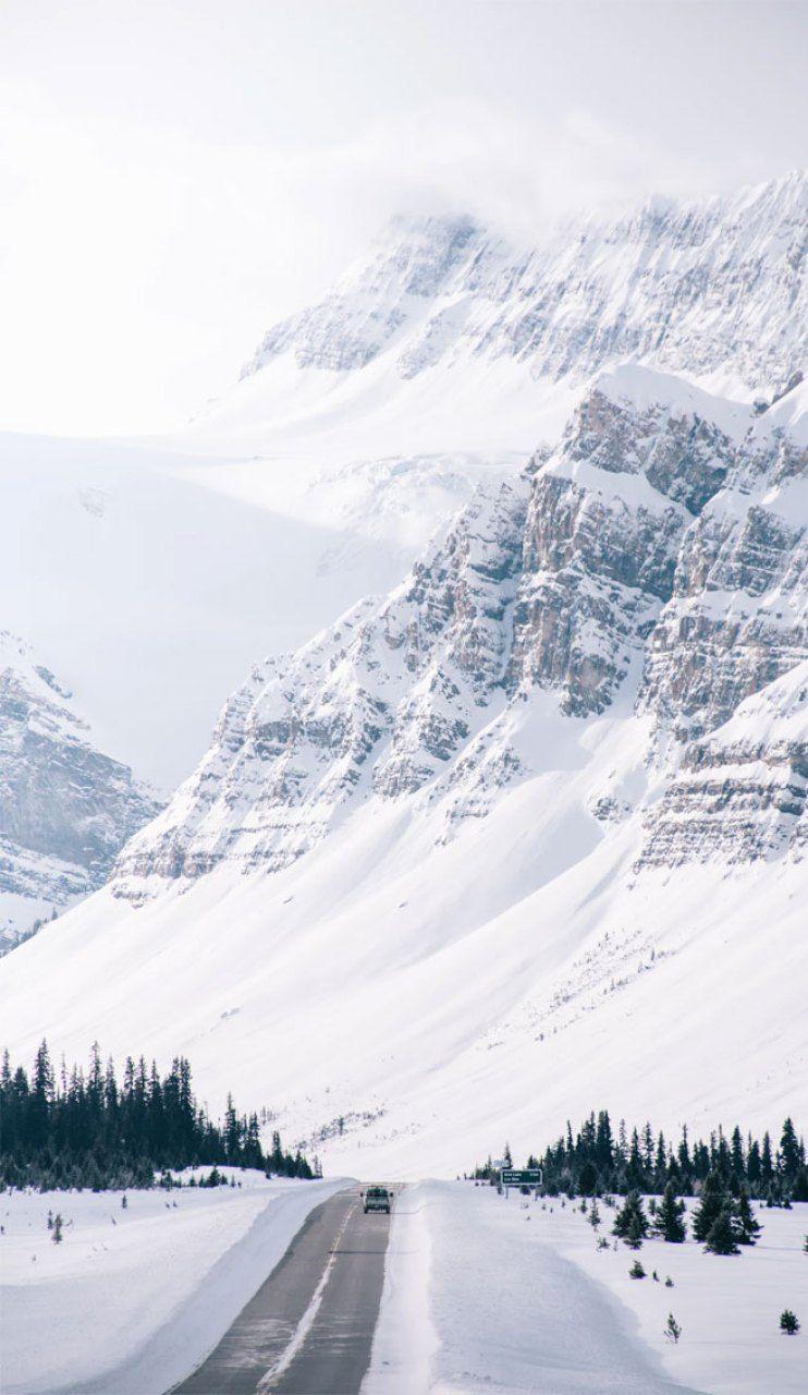 742x1280 White and grey beautiful scenery of snow on mountains Wallpaper