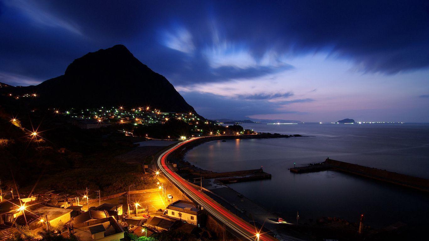 1366x768 Download wallpaper 1366x768 night, hill, road, ocean, beach tablet, laptop HD background