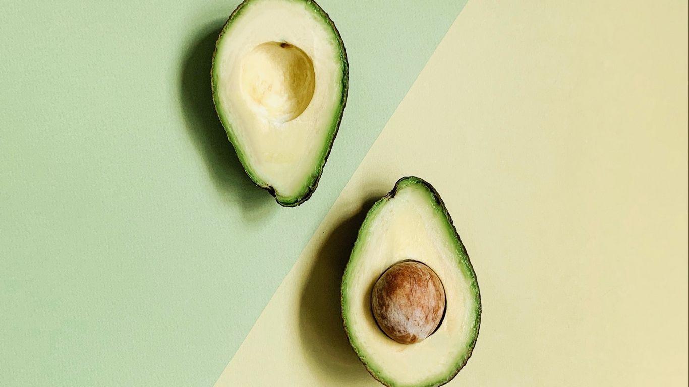 1366x768 Download wallpaper 1366x768 avocado, fruit, green, halves, tropical tablet, laptop HD background