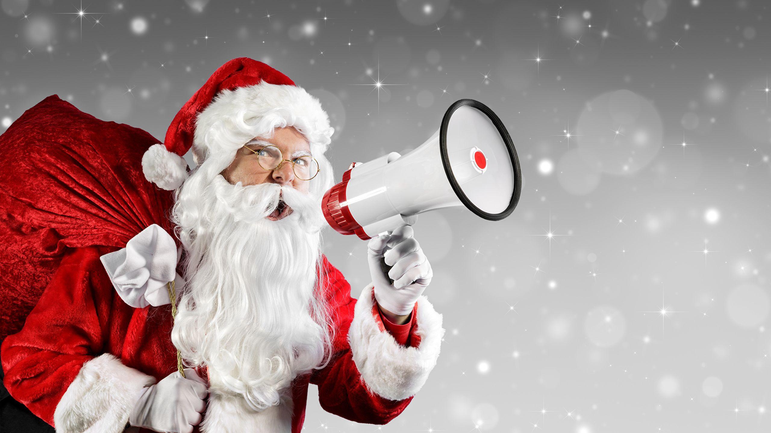2560x1440 Image New year Megaphone Snowflakes Winter hat Santa Claus 2560x1440