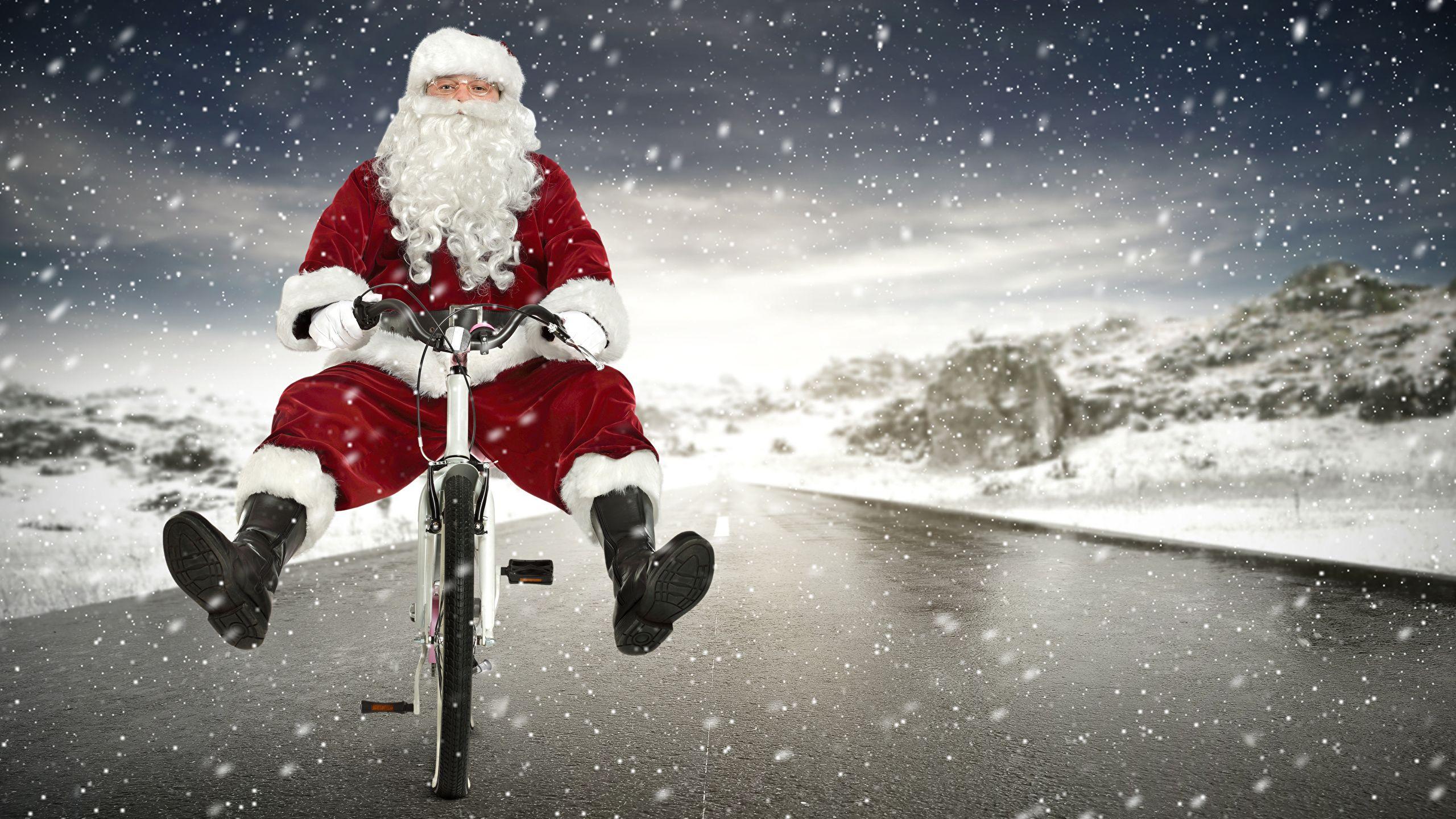 2560x1440 Christmas Santa Claus Uniform Bicycle Snow wallpaperx1440