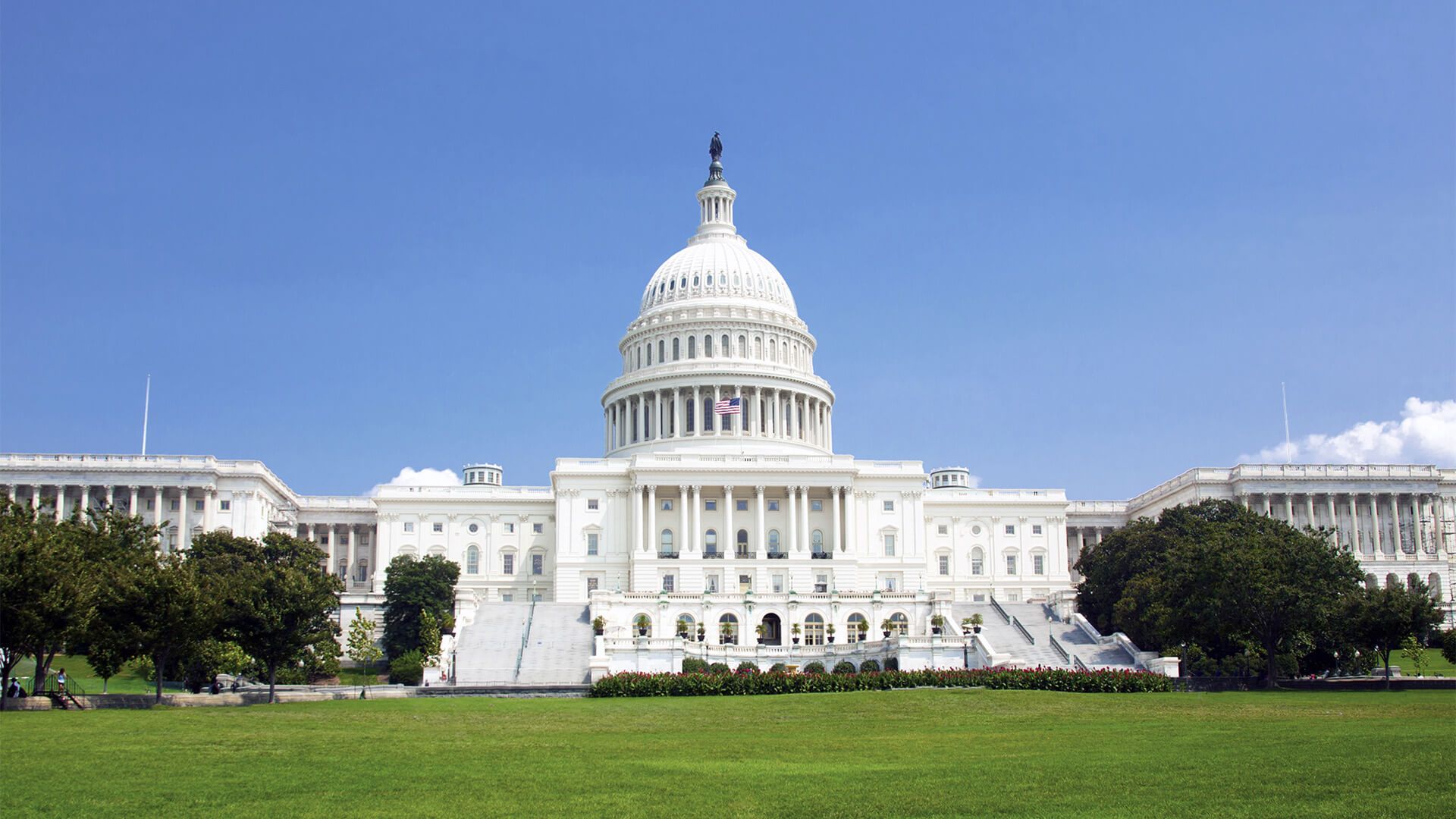 1920x1080 The image shows the United States Capitol building in Washington, D.C., set against a clear blue