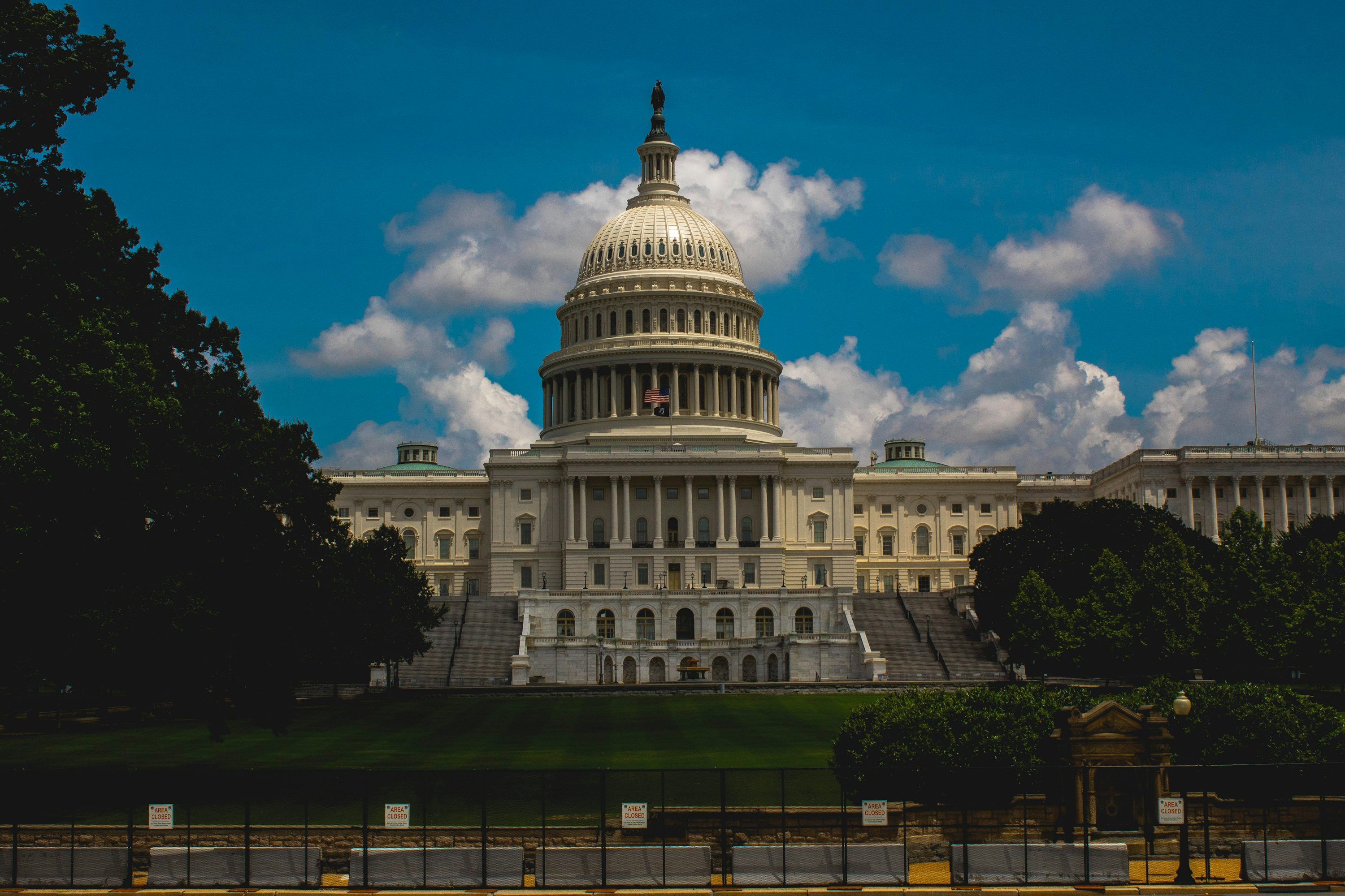 3000x2000 A large white building with a dome with United States Capitol in the background