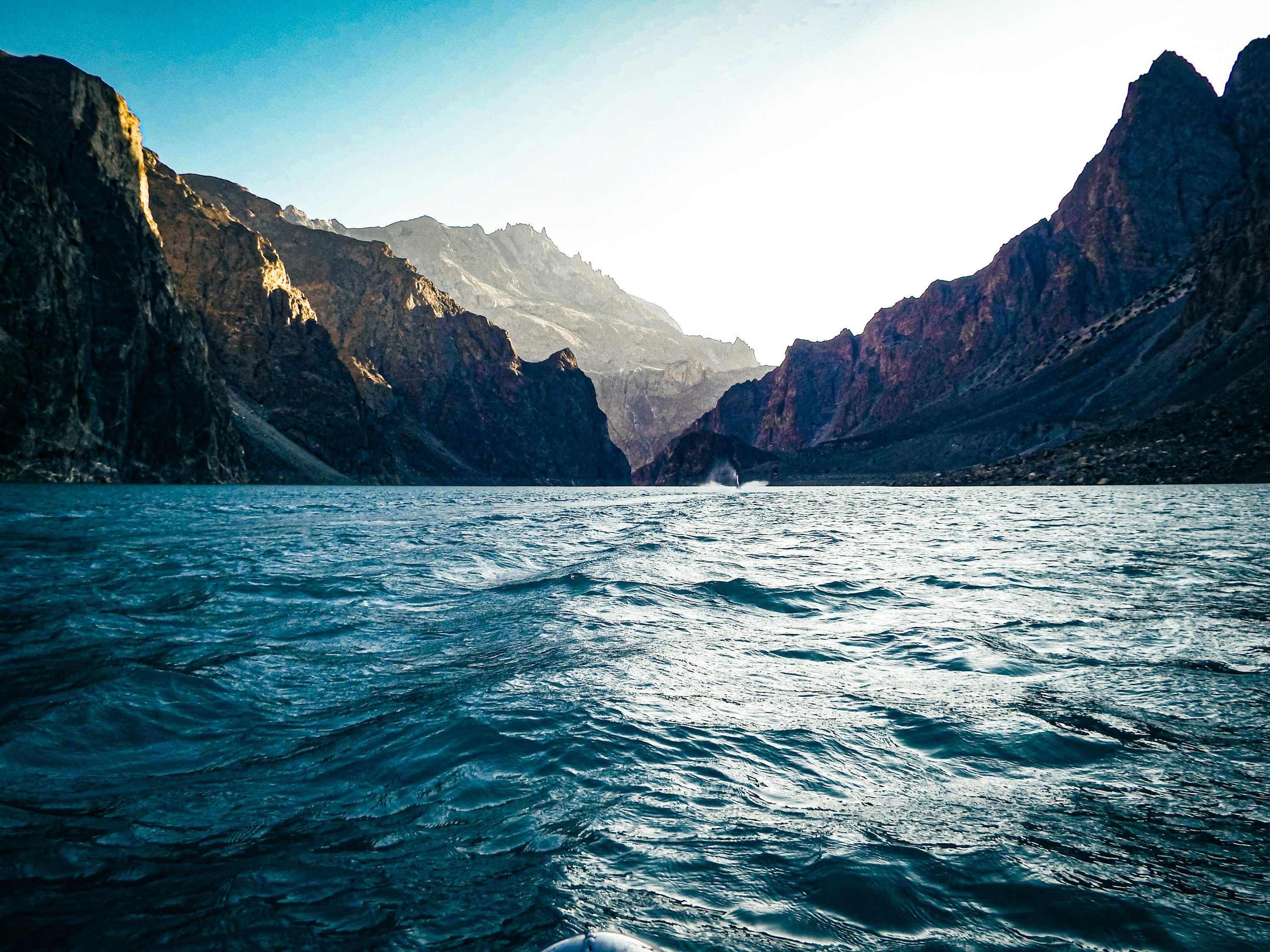 3000x2250 A body of water with a rocky shoreline with Tracy Arm in the background