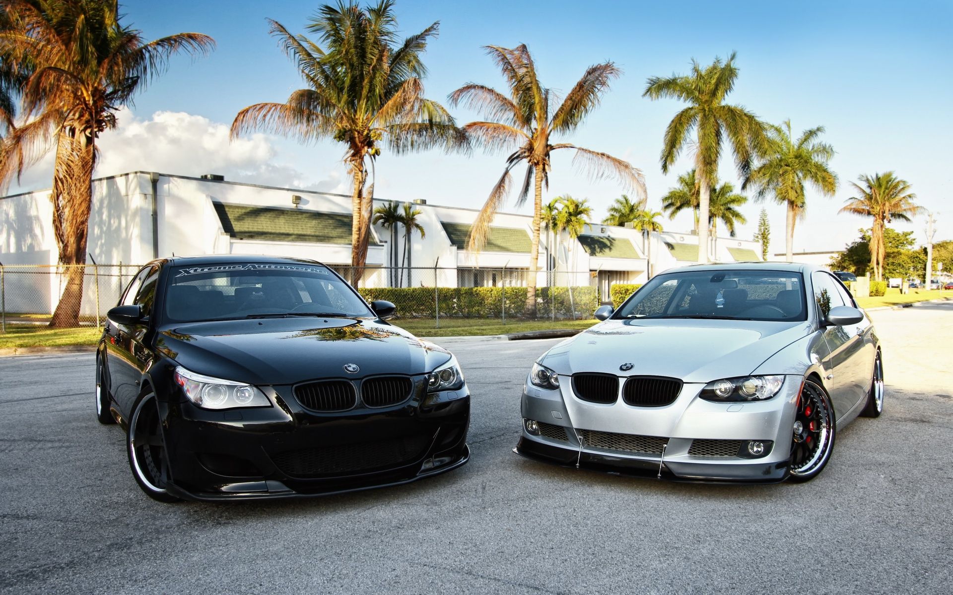 1920x1200 BMW Dual Elegance: HD Wallpaper Featuring Sleek Black and White Vehiclesx1200