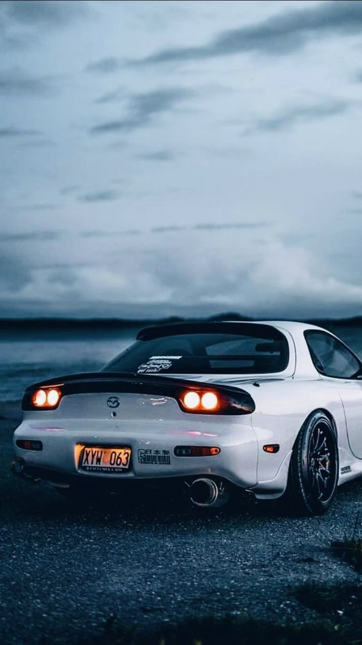 736x1309 White Mazda RX7 Sports Car. Car modification inspiration, Custom car with spoiler, Evening car photo