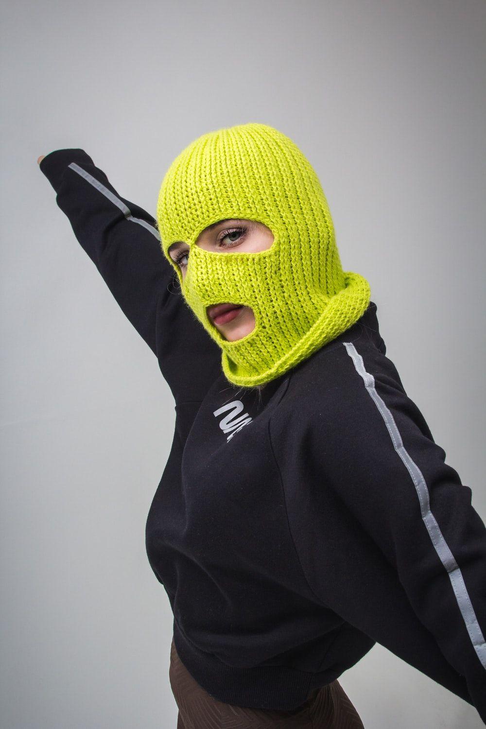 1000x1500 woman in black jacket with yellow ski mask photo
