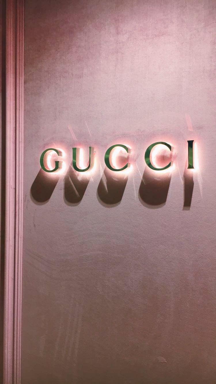 750x1334 Cool Golden Gucci Wallpaper