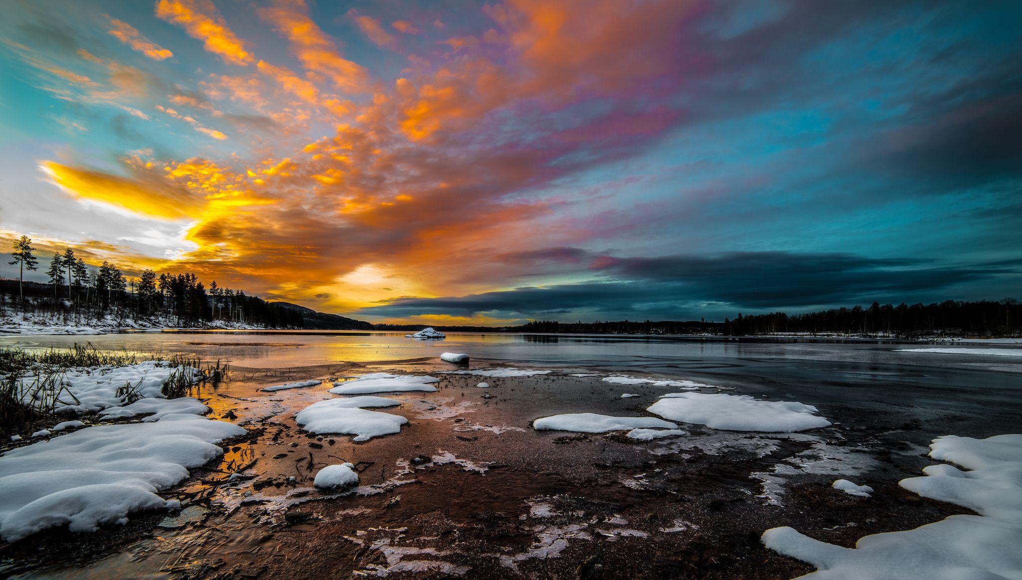 2048x1163 Morning ice sunrise lake snow forest .