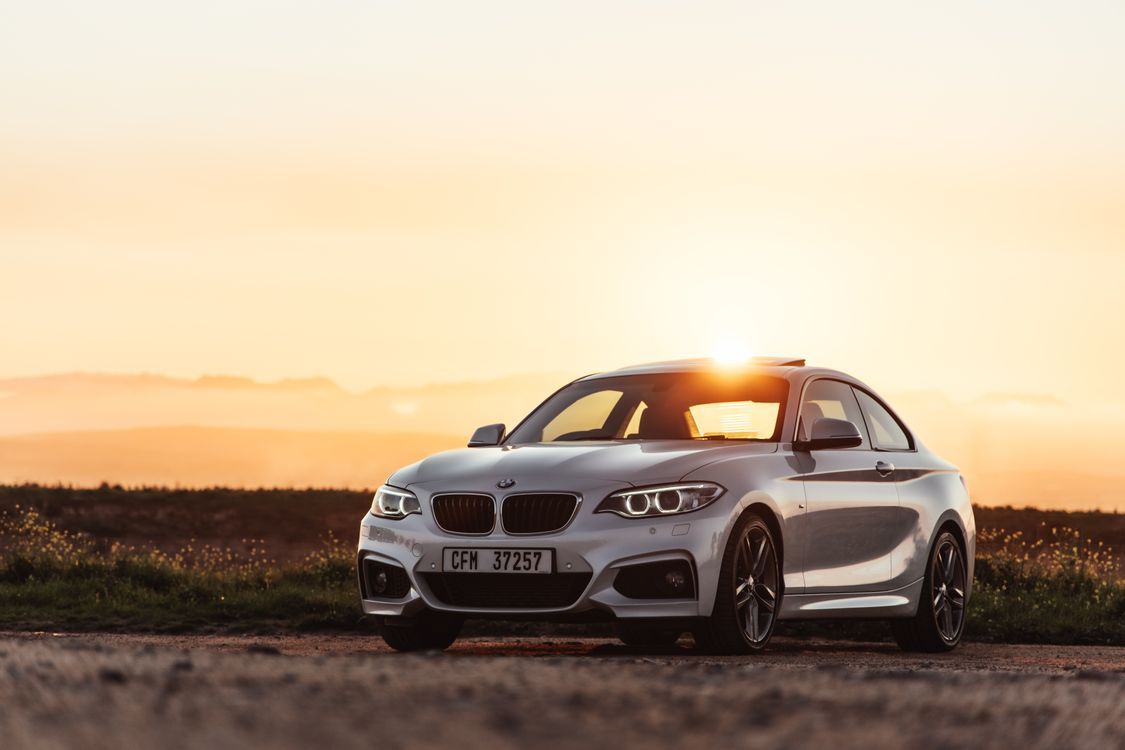 1125x750 Parked White BMW Coupe · Free