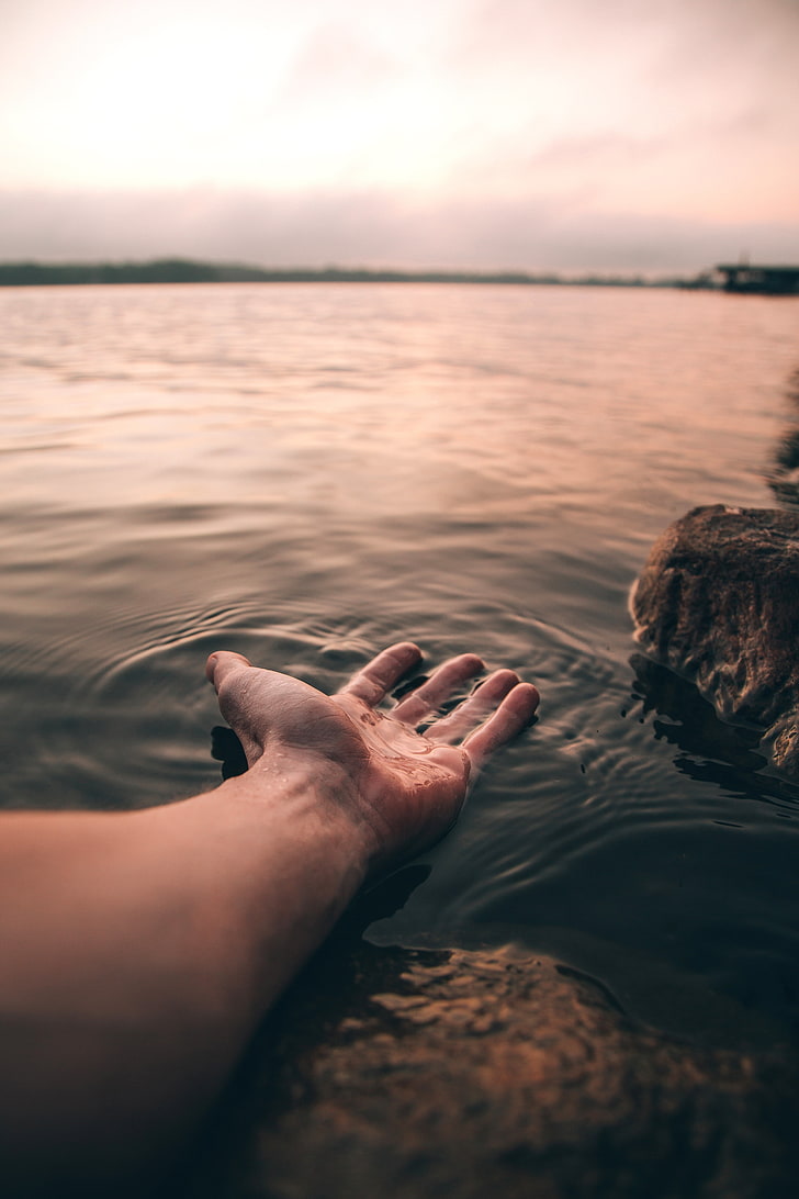 728x1092 HD wallpaper: hand, water, touch, blur, human body part, sea, one person