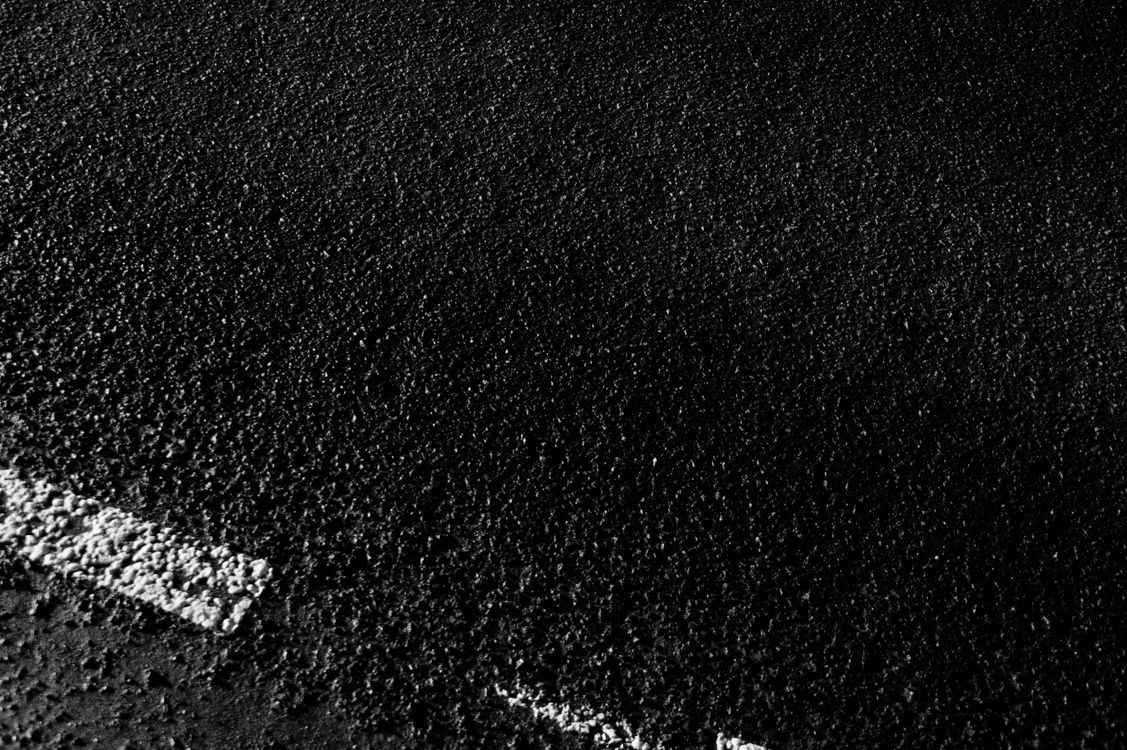 1127x750 Textured backdrop of rough road with marking lines · Free
