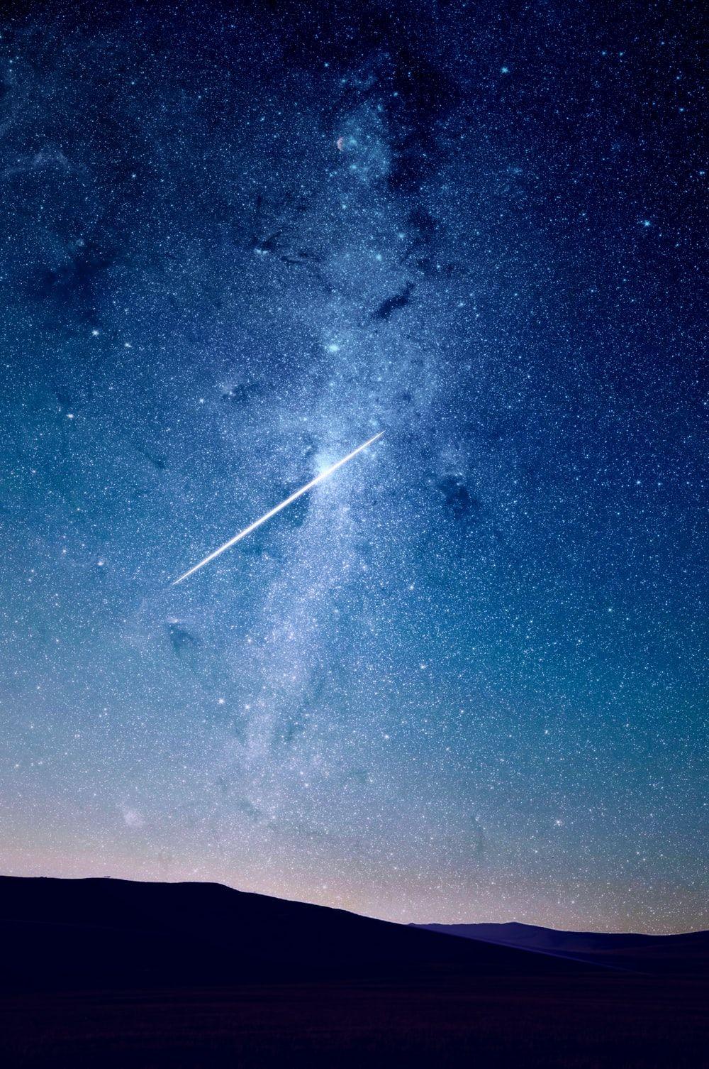 1000x1506 shooting star under blue sky photo .com