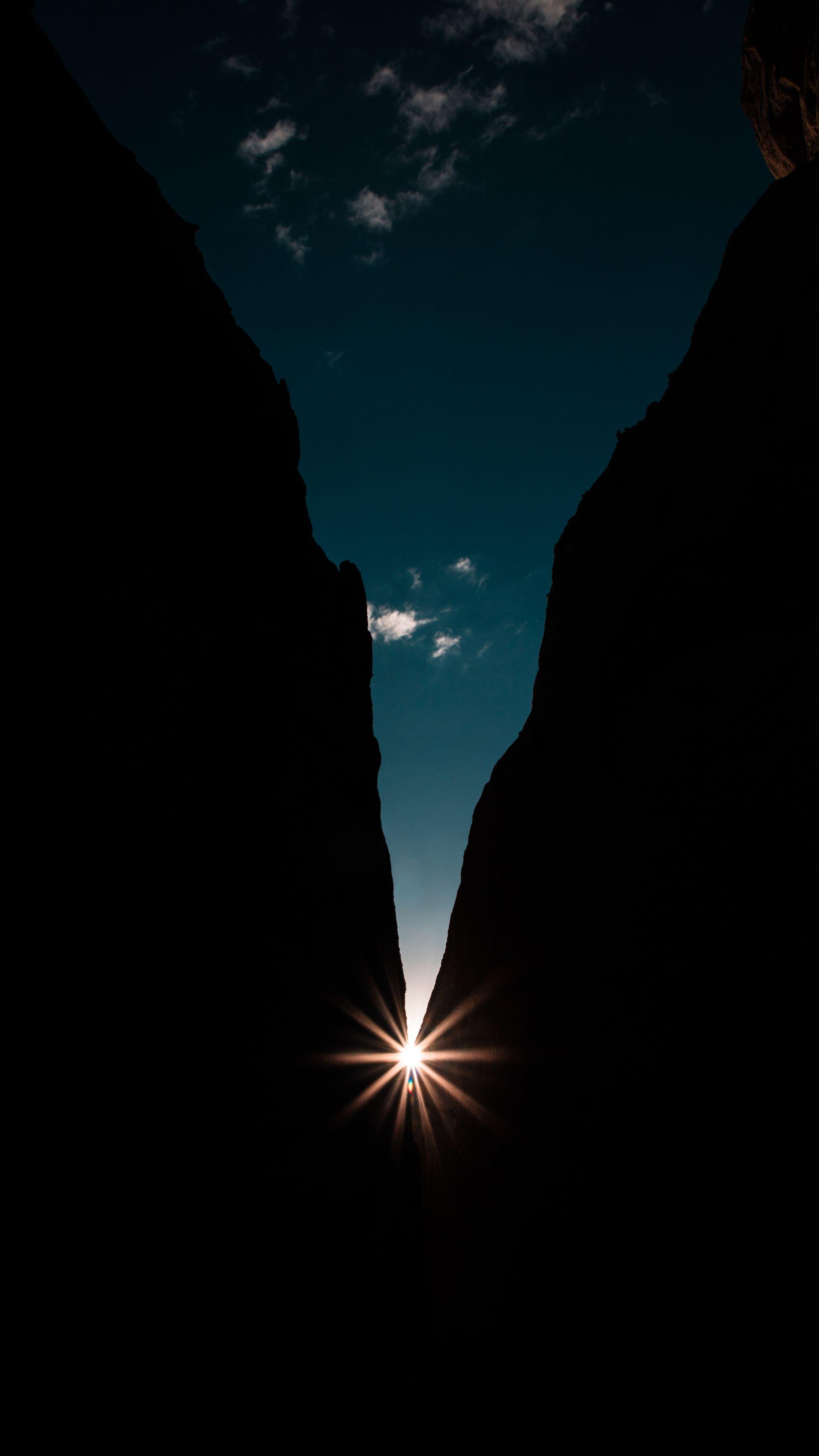 2160x3840 Download Rocks, night, sun rays, dark .