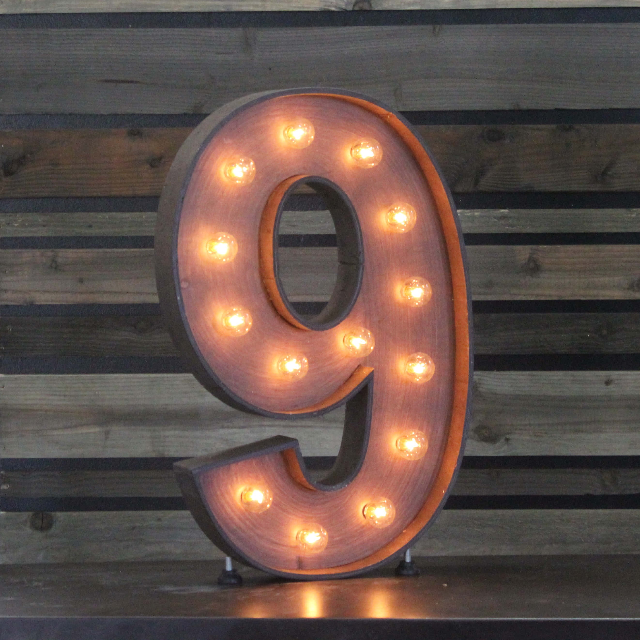 2644x2644 Download a wooden number with lights on it Wallpaper