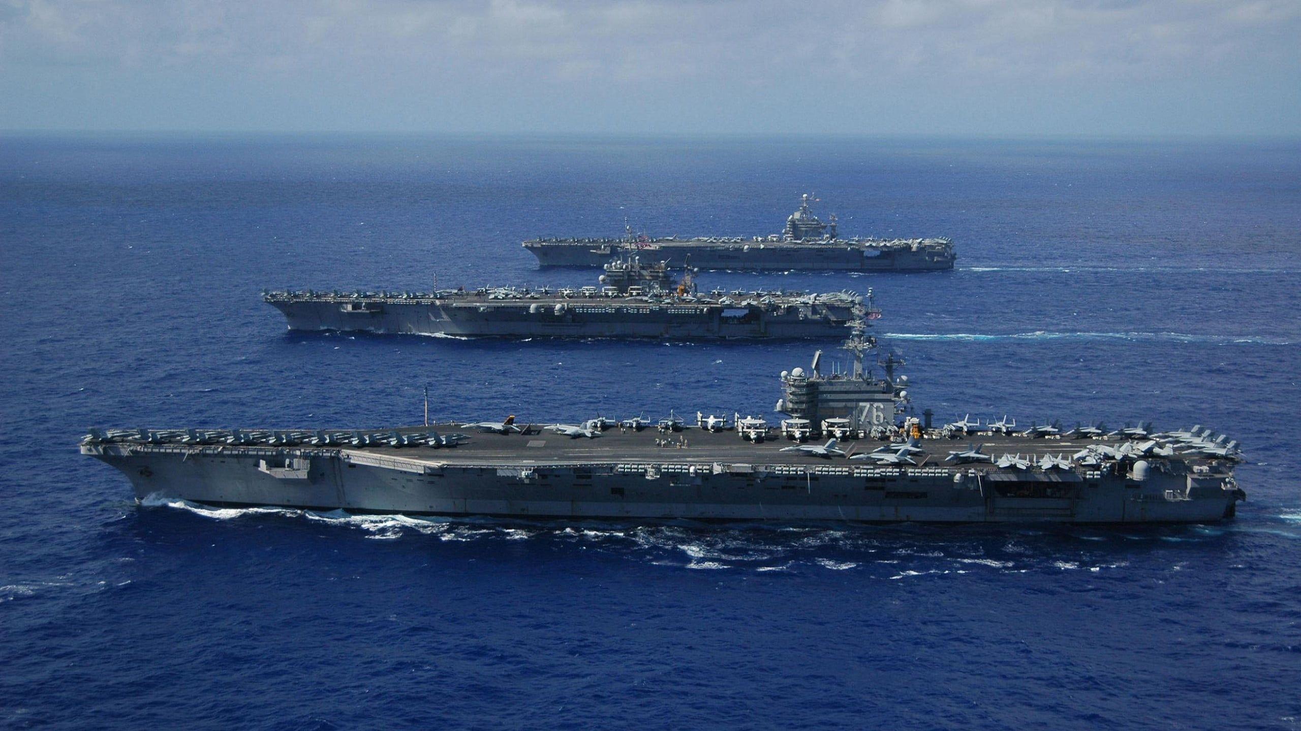 2560x1440 Three gray aircraft carriers sailing during day HD wallpaper