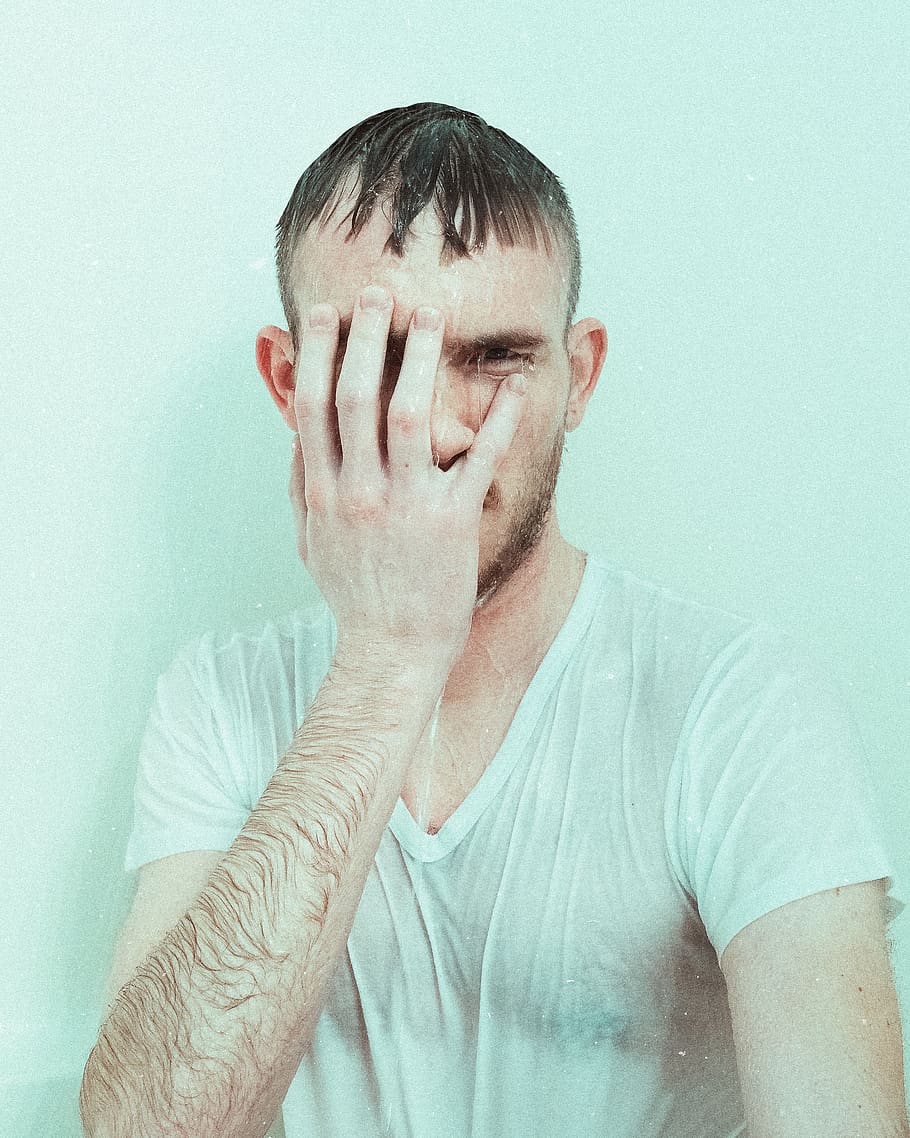 910x1138 HD wallpaper: man resting his right hand on his face who is soaking wet, human