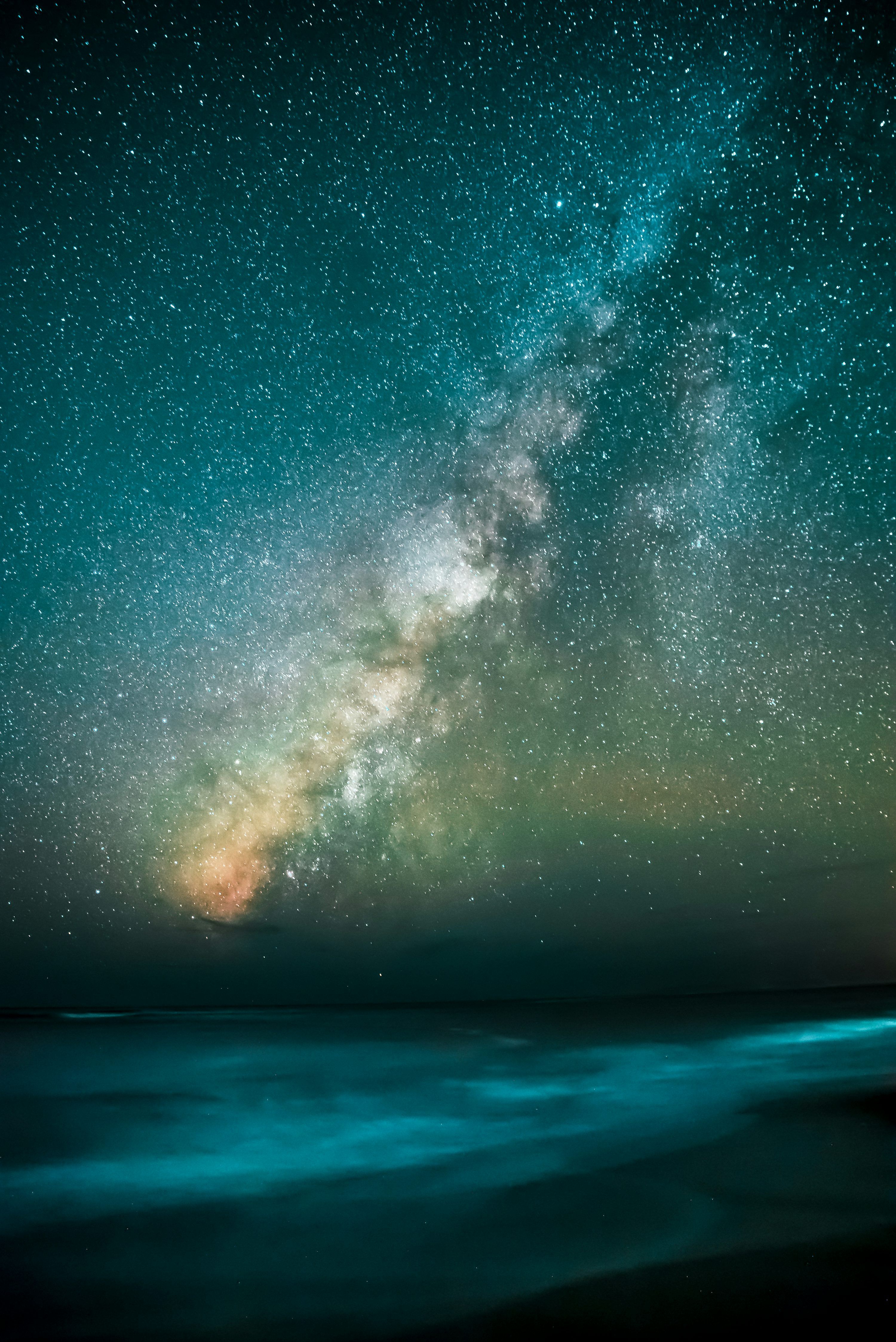 3000x4493 Stars overlooking body of water during nighttime