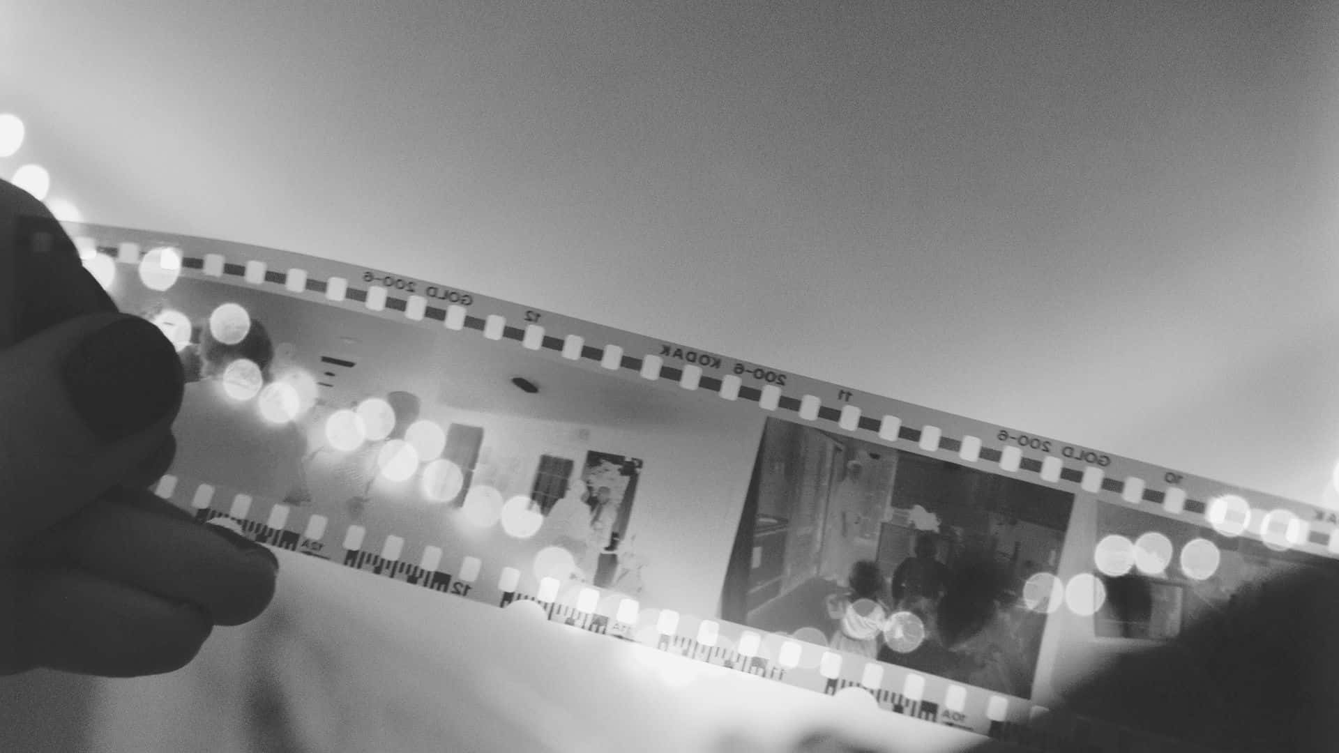 1920x1080 Download Classic black and white movie scene featuring a couple in a romantic embrace Wallpaper