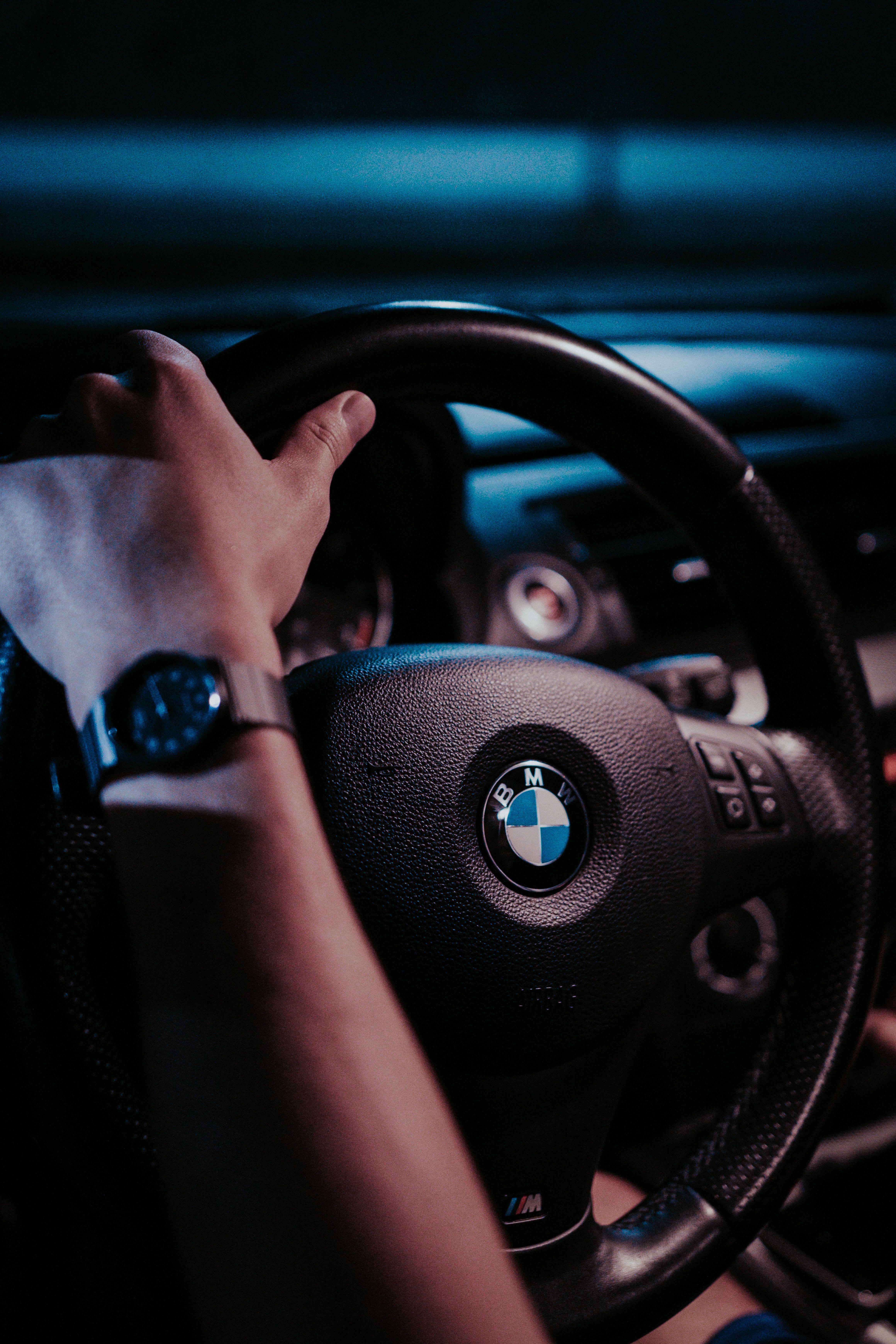 4640x6960 Person Holding BMW Steering Wheel .