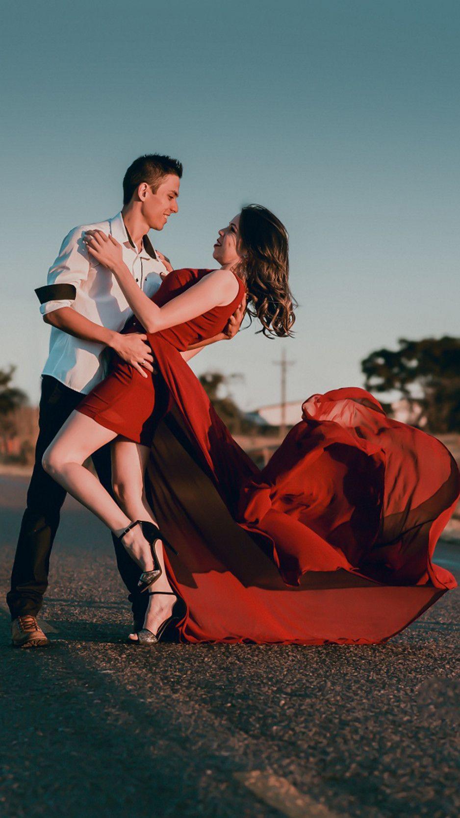 938x1668 Couple romance love hugs and dance on .