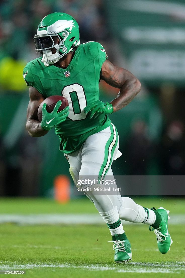 736x1104 D'Andre Swift of the Philadelphia Eagles runs the ball against the