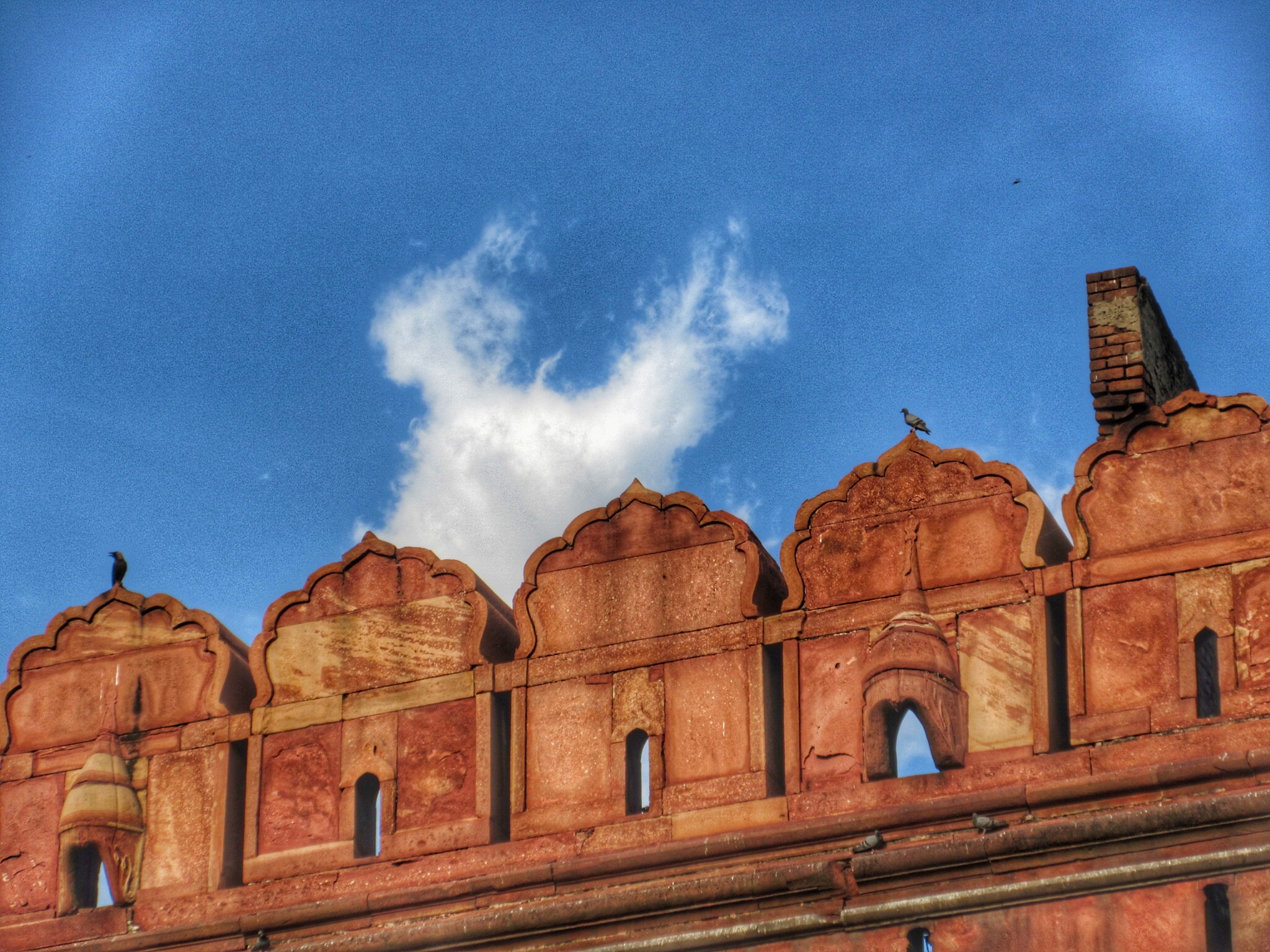 2048x1536 INDIA's map made of clouds in the sky behind the walls of THE RED