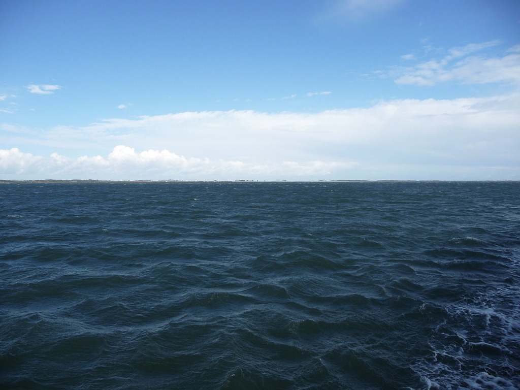 1024x768 A large body of water with a sky in the background. Open