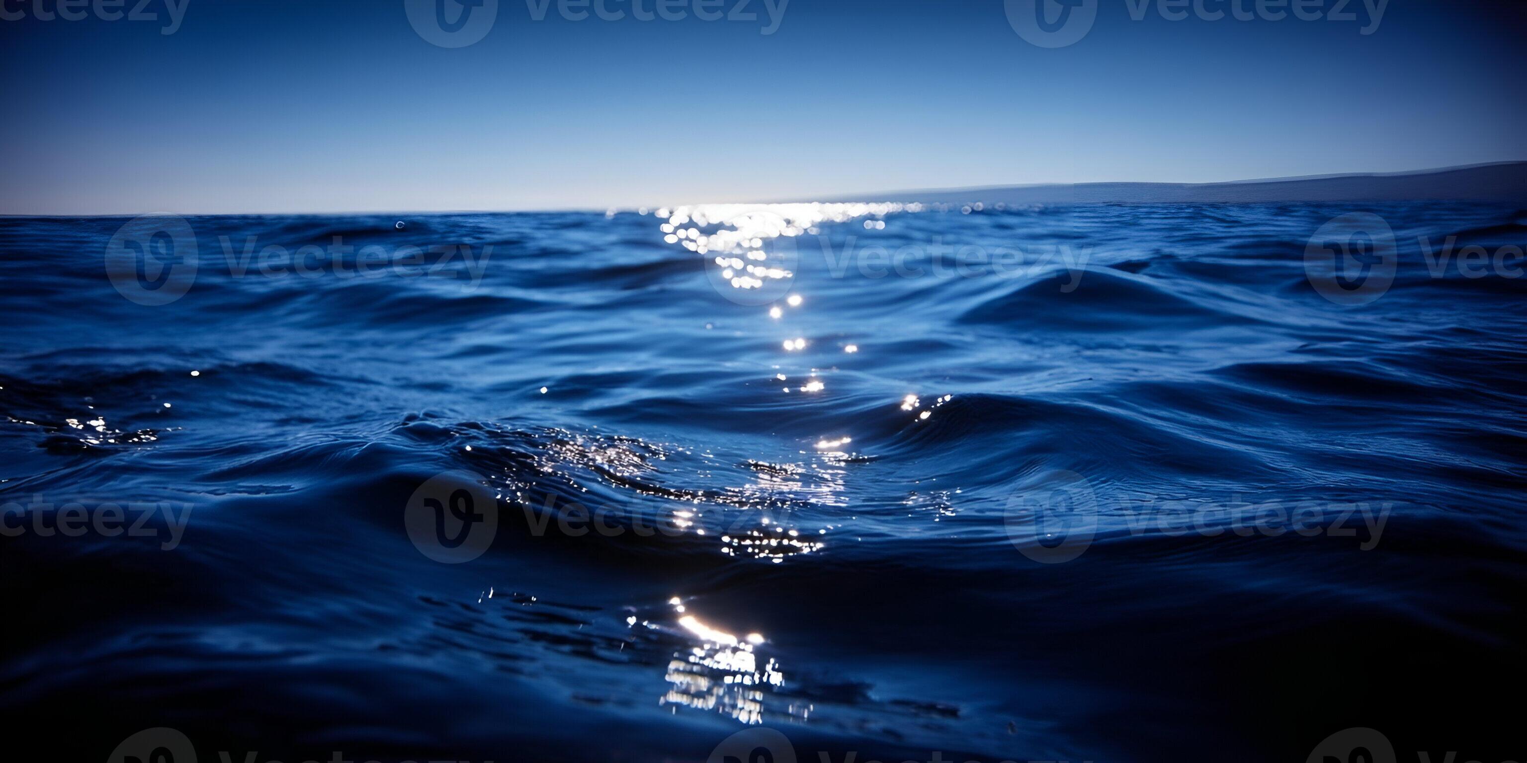3072x1536 Vast deep blue ocean waves sparkle with sun reflections under a clear open sky