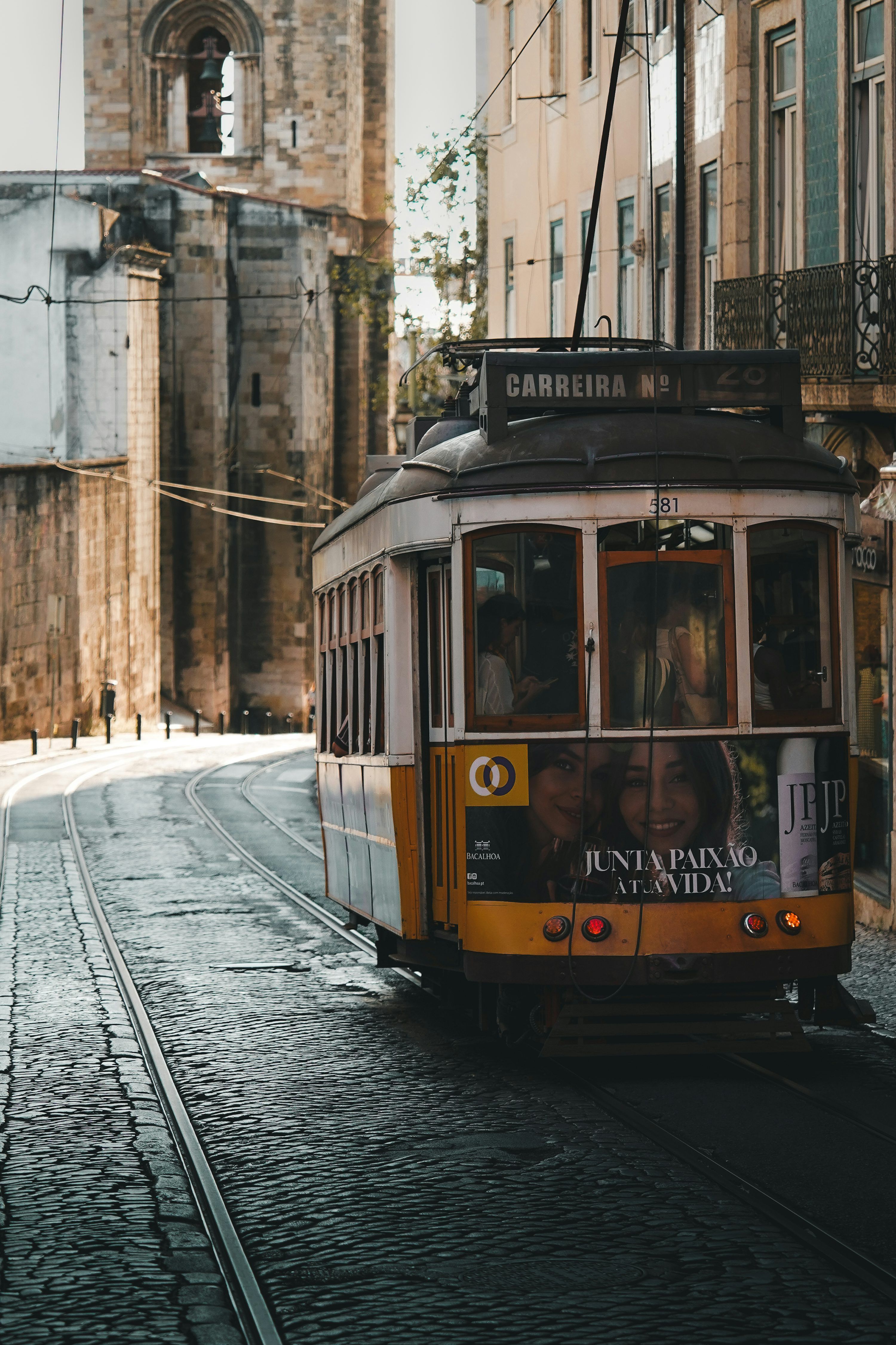 3000x4500 A trolley car on a city street with buildings in the background photo