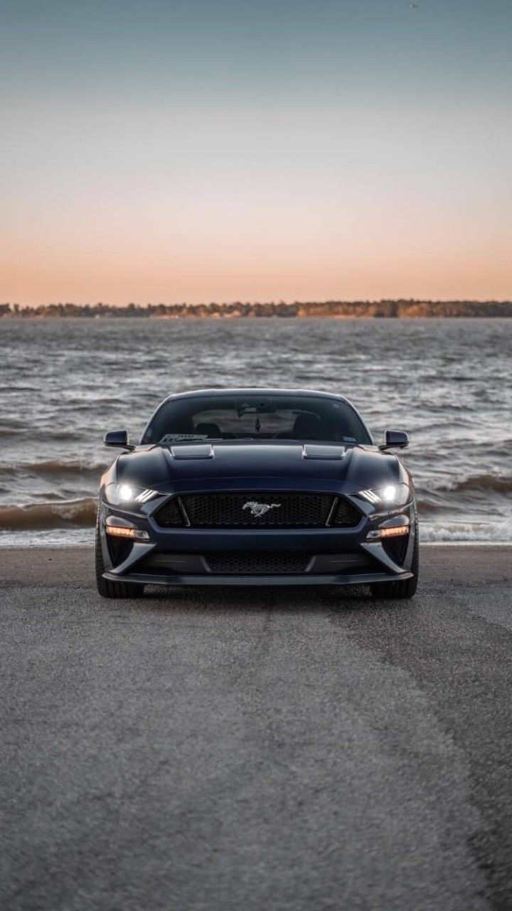 720x1280 BMW IX. Car Aesthetic. Cool Cars. Car Wallpaper. Black ford mustang by the sea, Dream car inspiration, Luxury sports car beach view