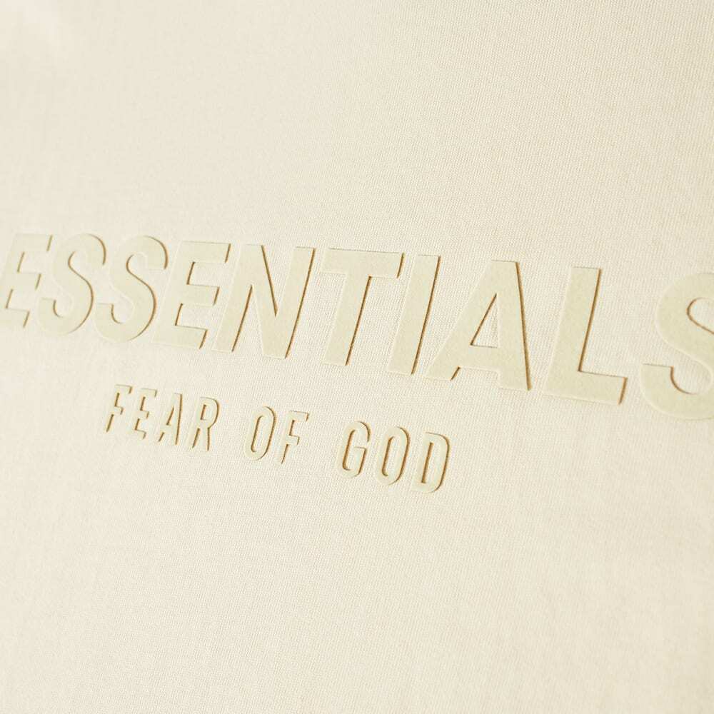 1000x1000 Fear of God ESSENTIALS Women's Short Sleeve Logo Dress in Egg Shell Fear Of God Essentials