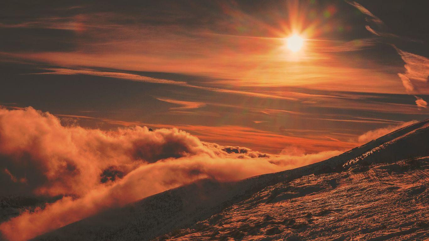 1366x768 Download wallpaper 1366x768 mountains, sunset, sky, snow tablet, laptop HD background
