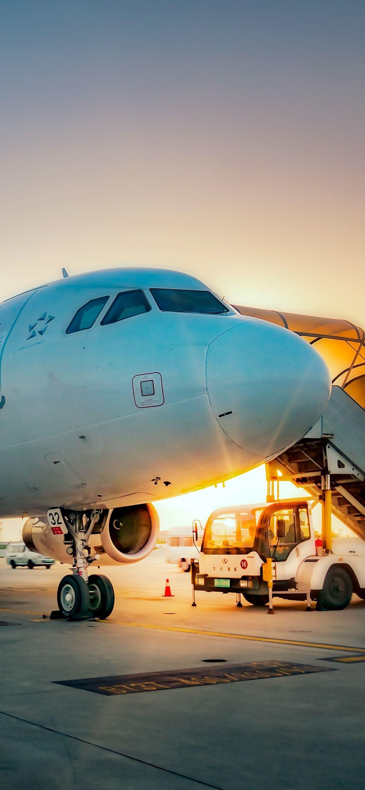 1242x2688 iPhone Wallpaper Airport, Plane, Sunrise Xs Max Plane Background