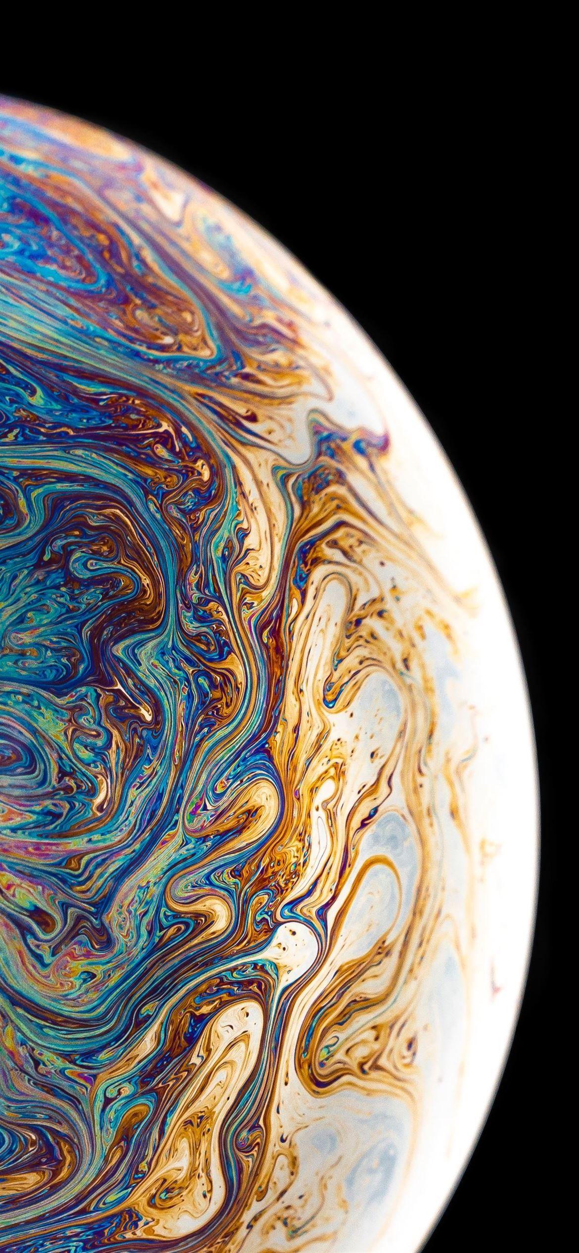 1170x2532 blue yellow and brown planet with black background iPhone 12 Wallpaper Free Download