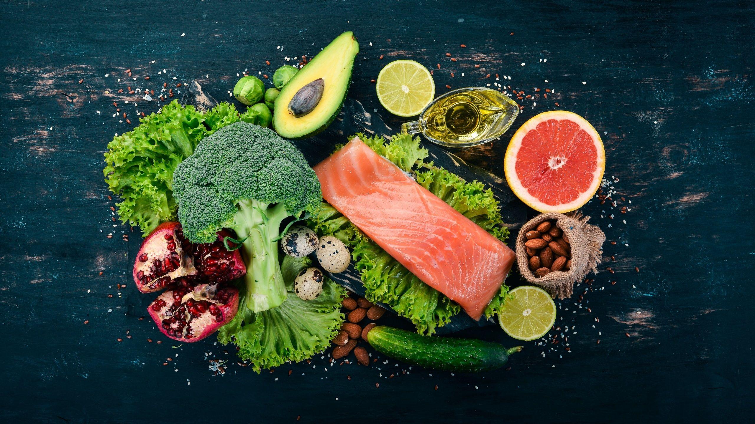 2560x1440 Red fish on the table with vegetables and fruits wallpaper and image, picture, photo