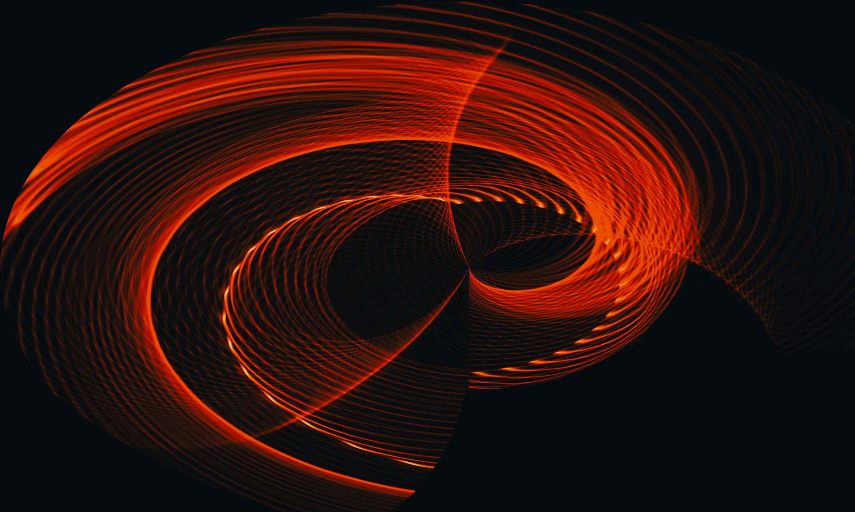 3000x1796 A black background with a red swirl in the middle