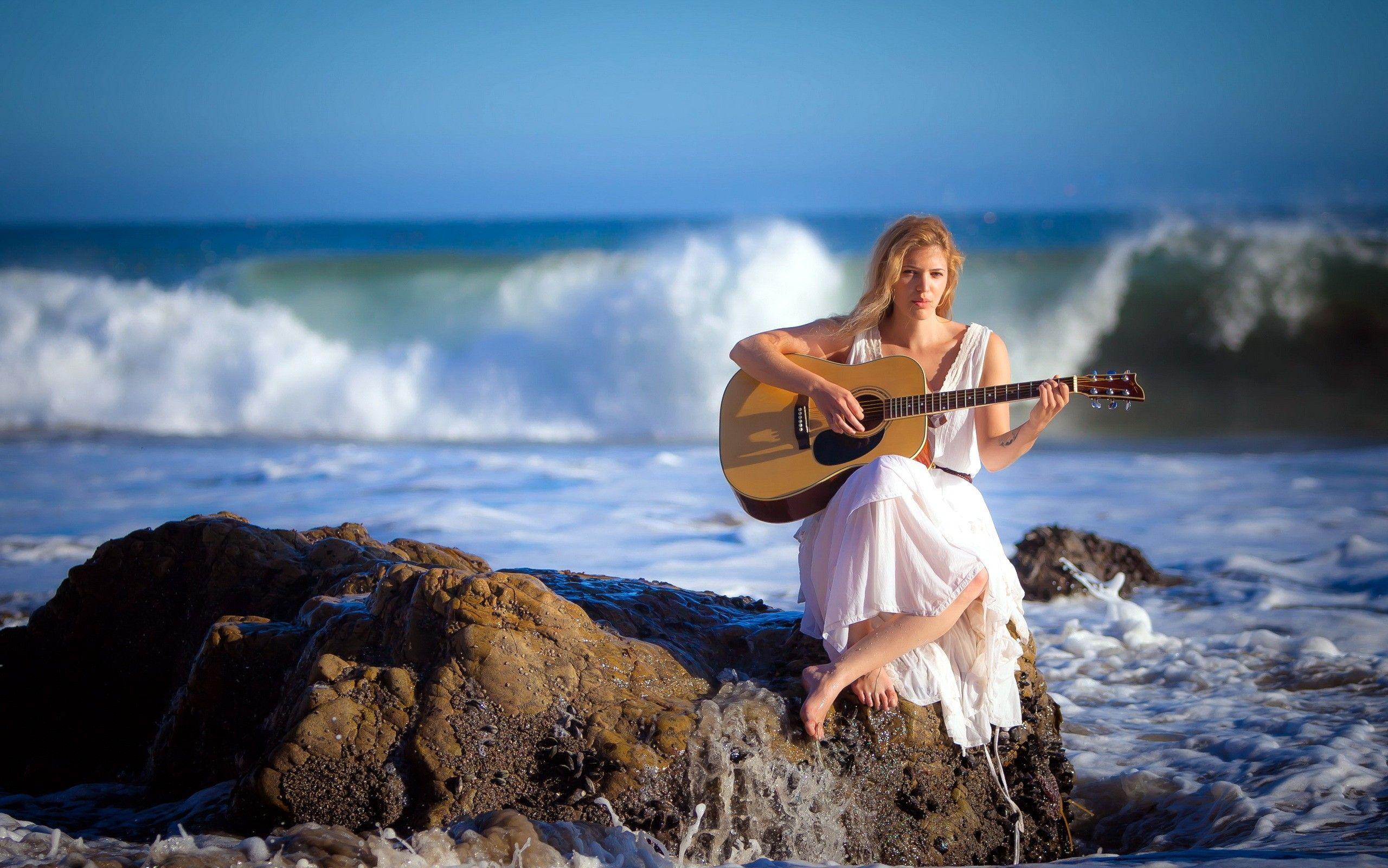 2560x1600 Woman playing guitar coast wallpaperx1600