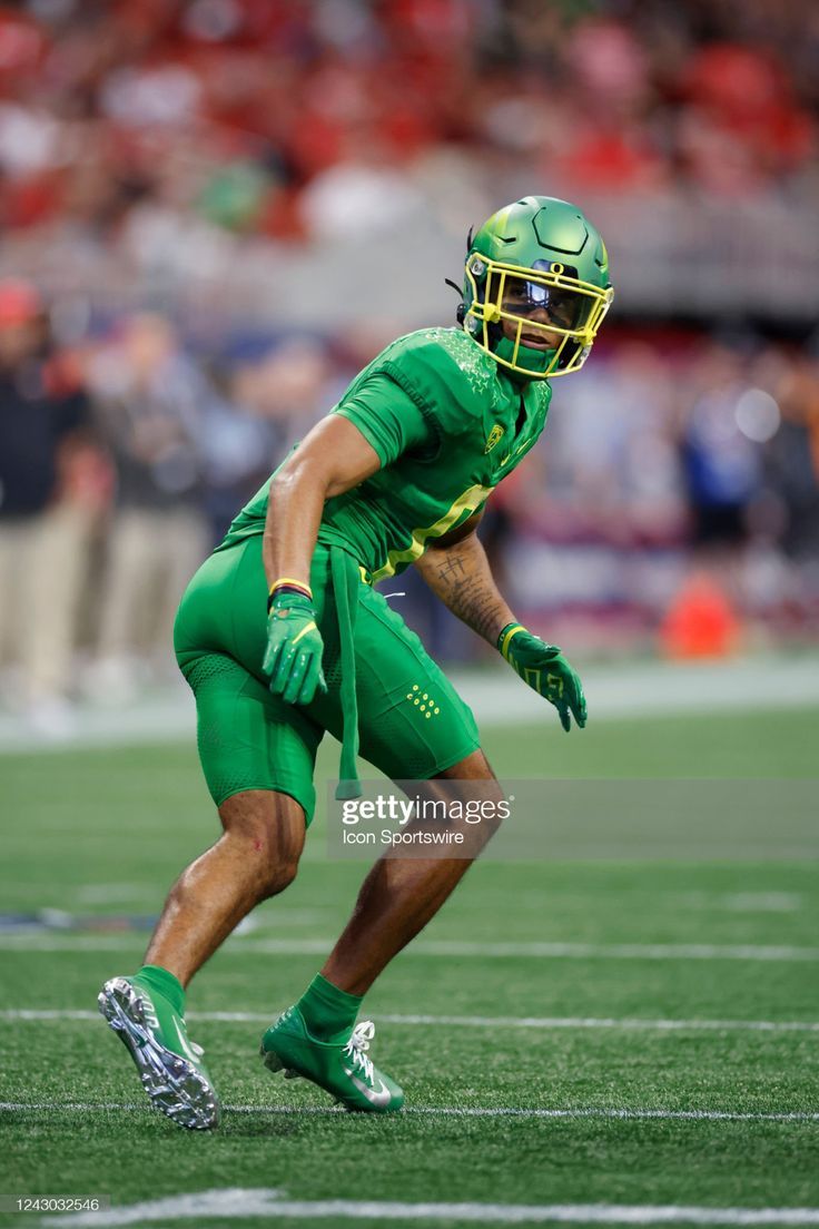 736x1104 Oregon Ducks defensive back Christian Gonzalez drops into coverage on. Oregon ducks football pink, Oregon