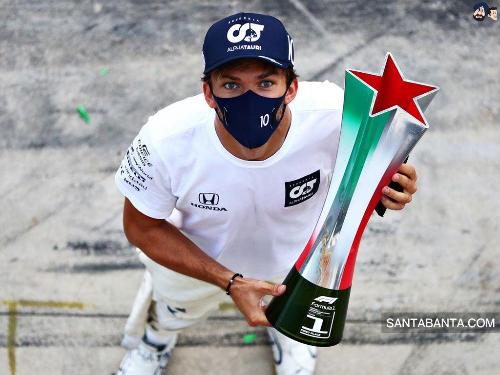 1024x768 French racing driver, Pierre Gasly holding his first F1 racing trophy