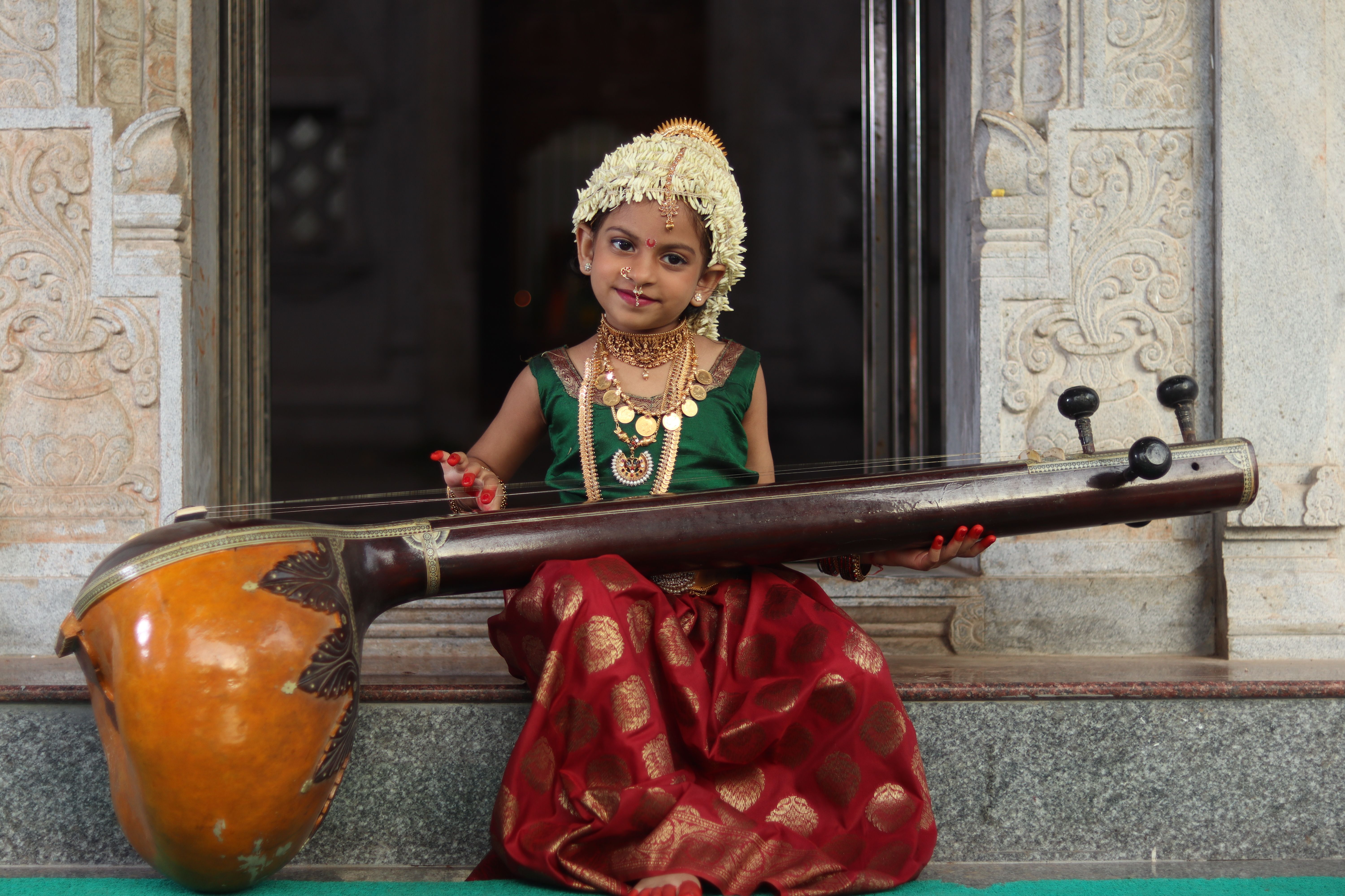 6000x4000 Cute Girl Playing Tanpura Instrument · Free