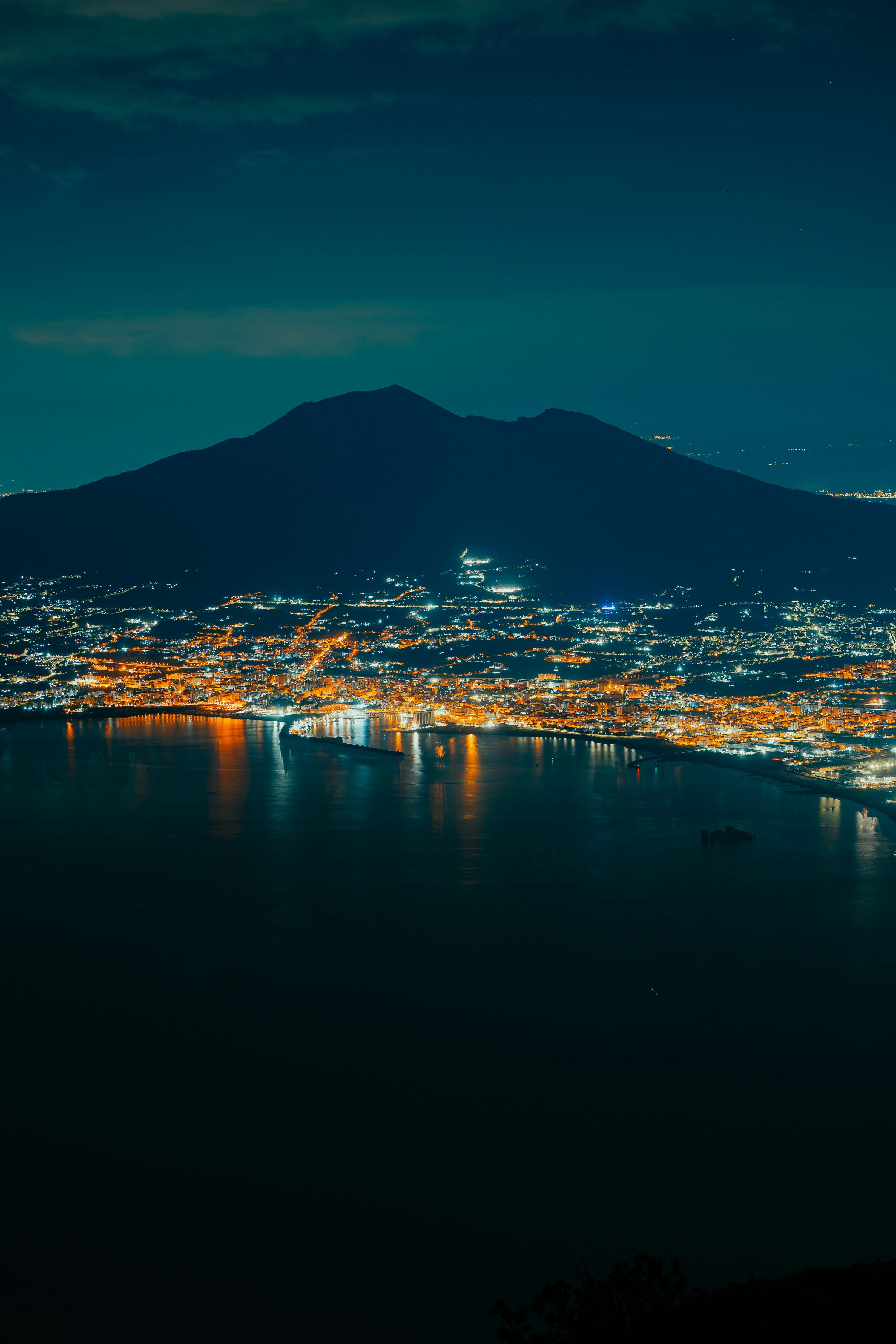 3000x4500 A view of a city at night from a hill