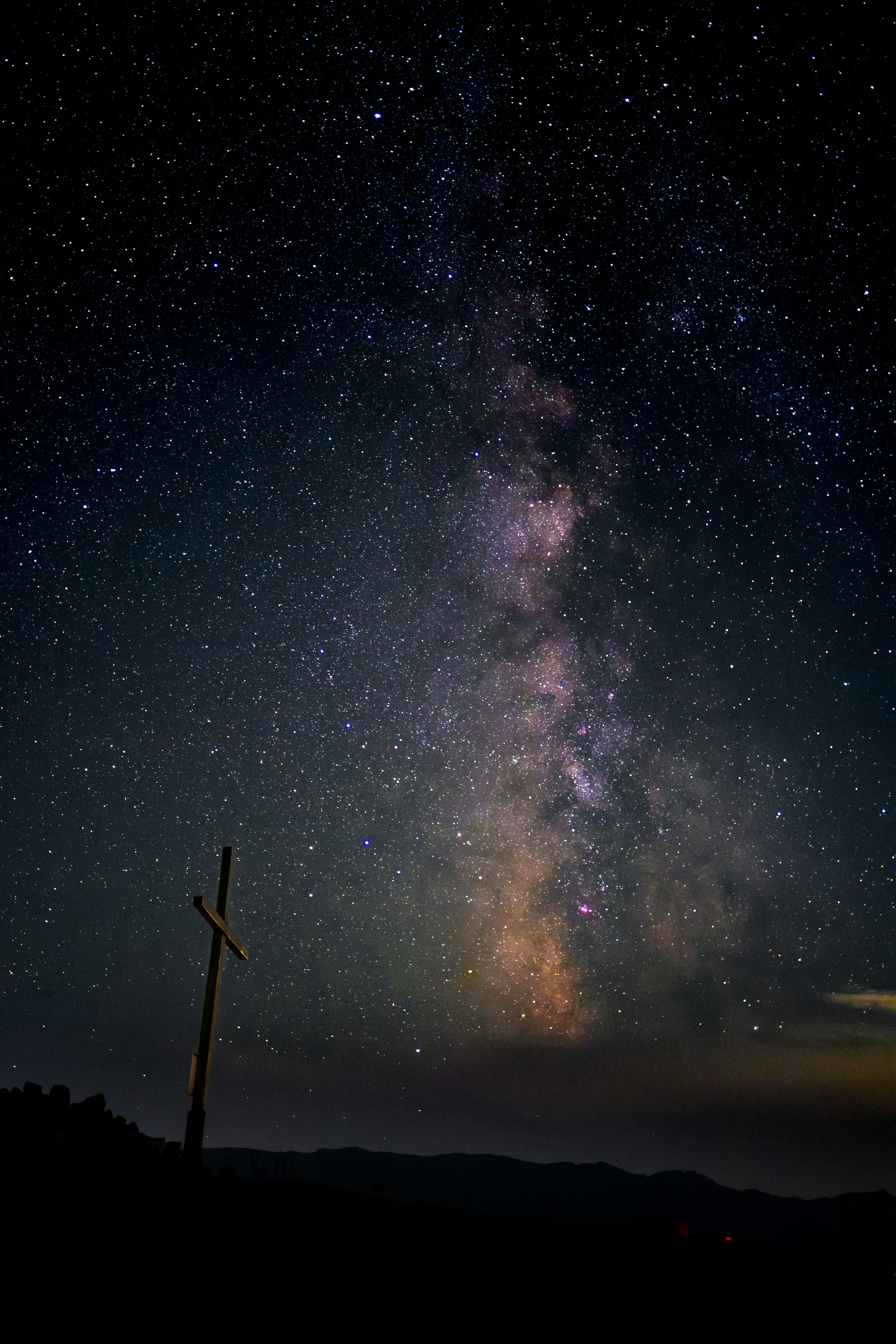 3000x4500 A cross on a hill under a night sky filled with stars