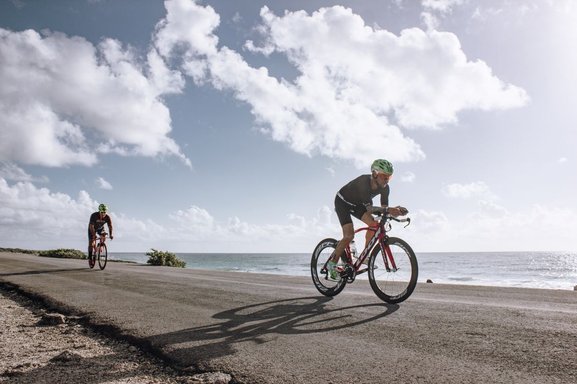 1125x750 Men Riding their Bicycles · Free