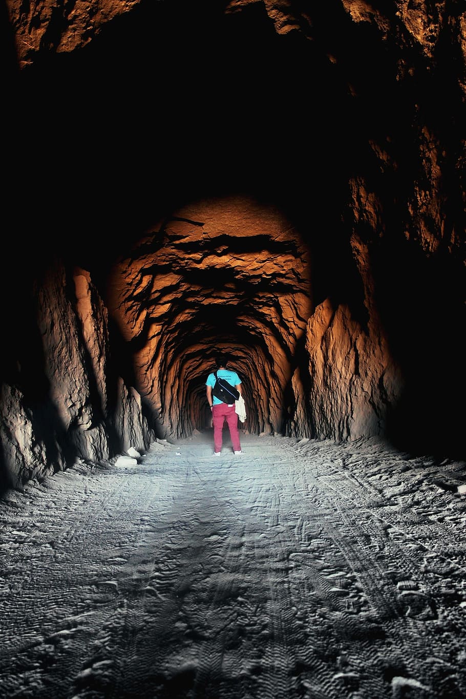910x1365 HD wallpaper: people, man, alone, travel, dark, tunnel, cave, light, real people