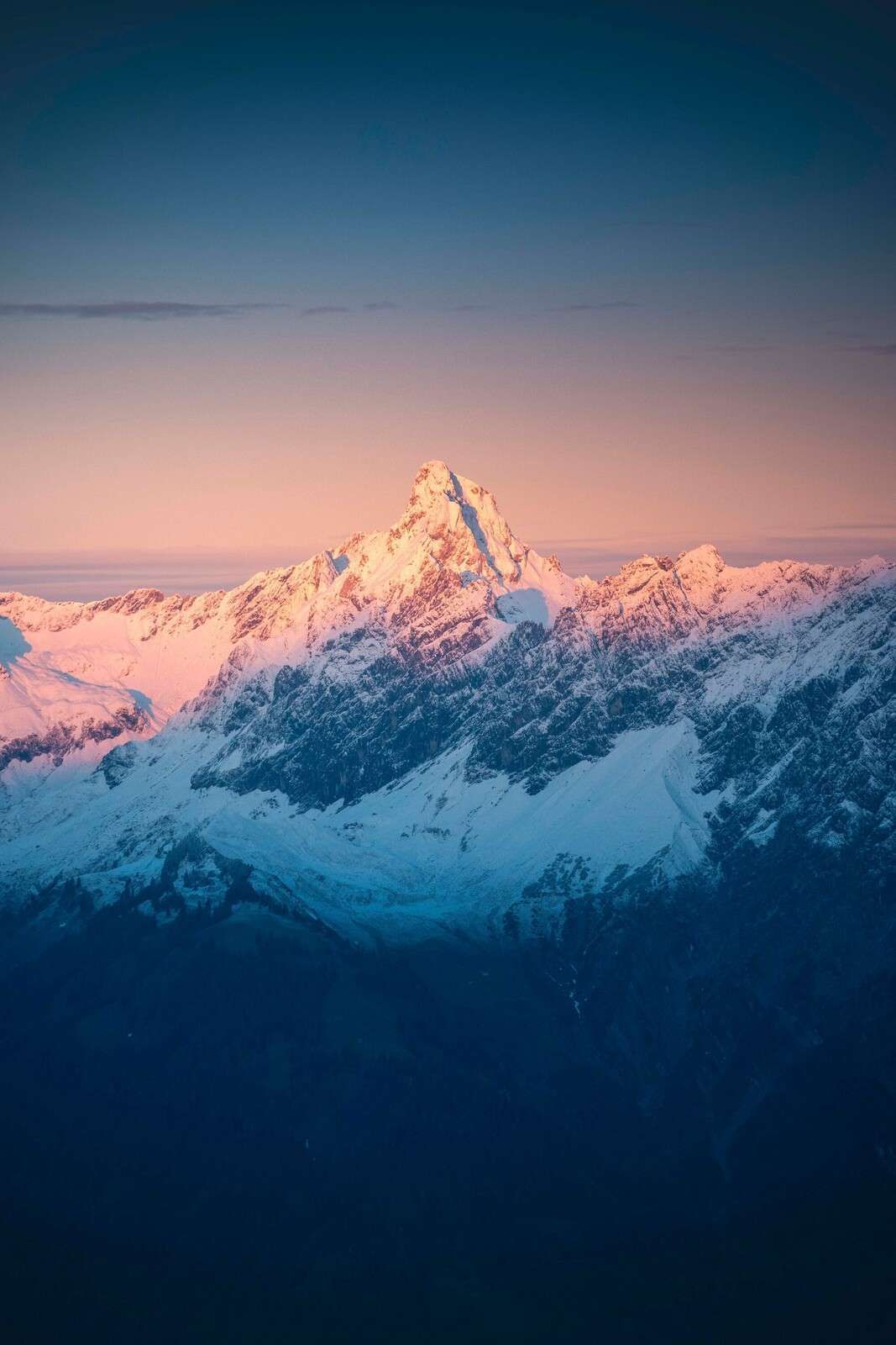 1067x1600 Wallpaper Mural Light On Snow Capped Mountain Peak