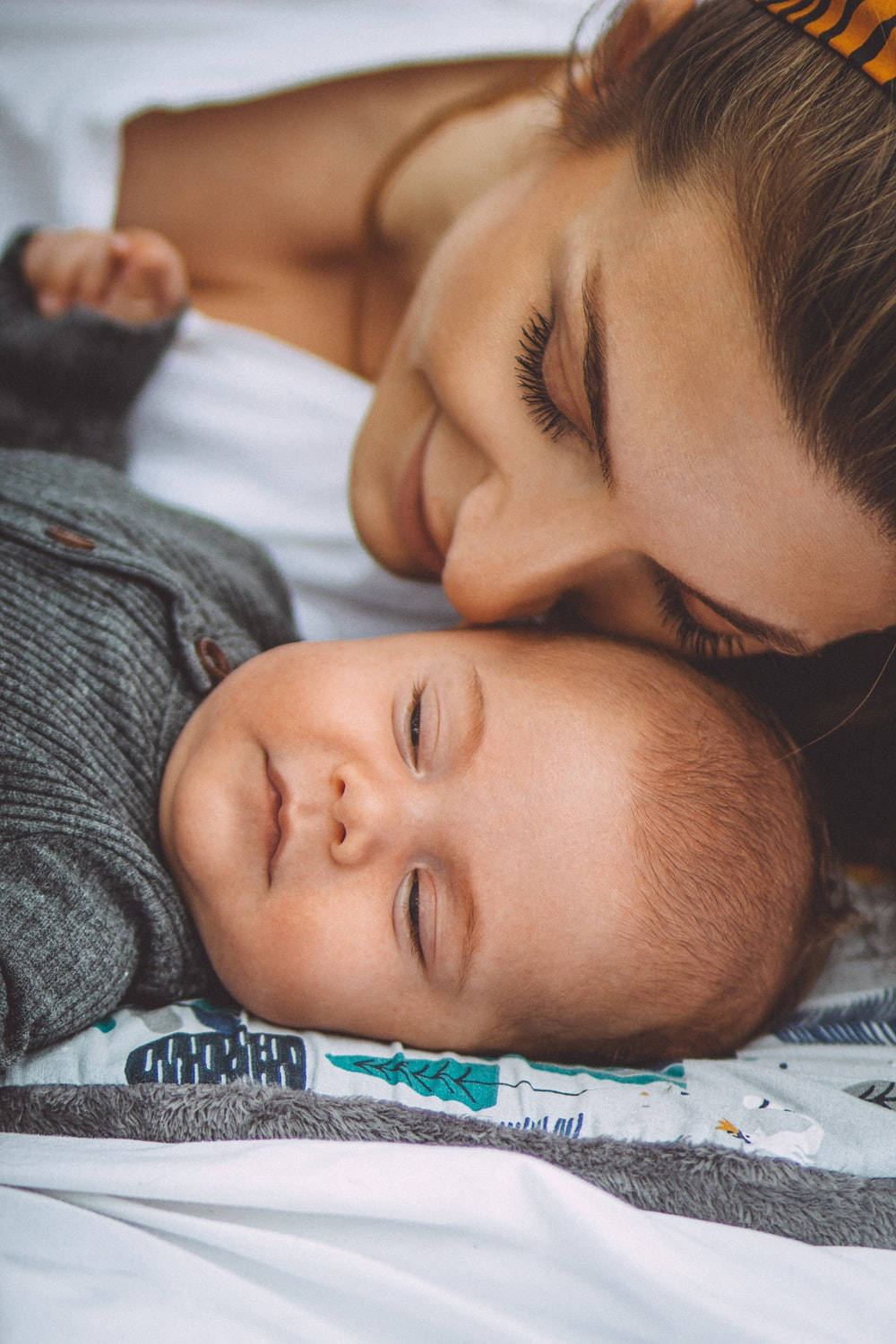 1000x1500 Download Mom and Son Smiling and Sleeping Wallpaper